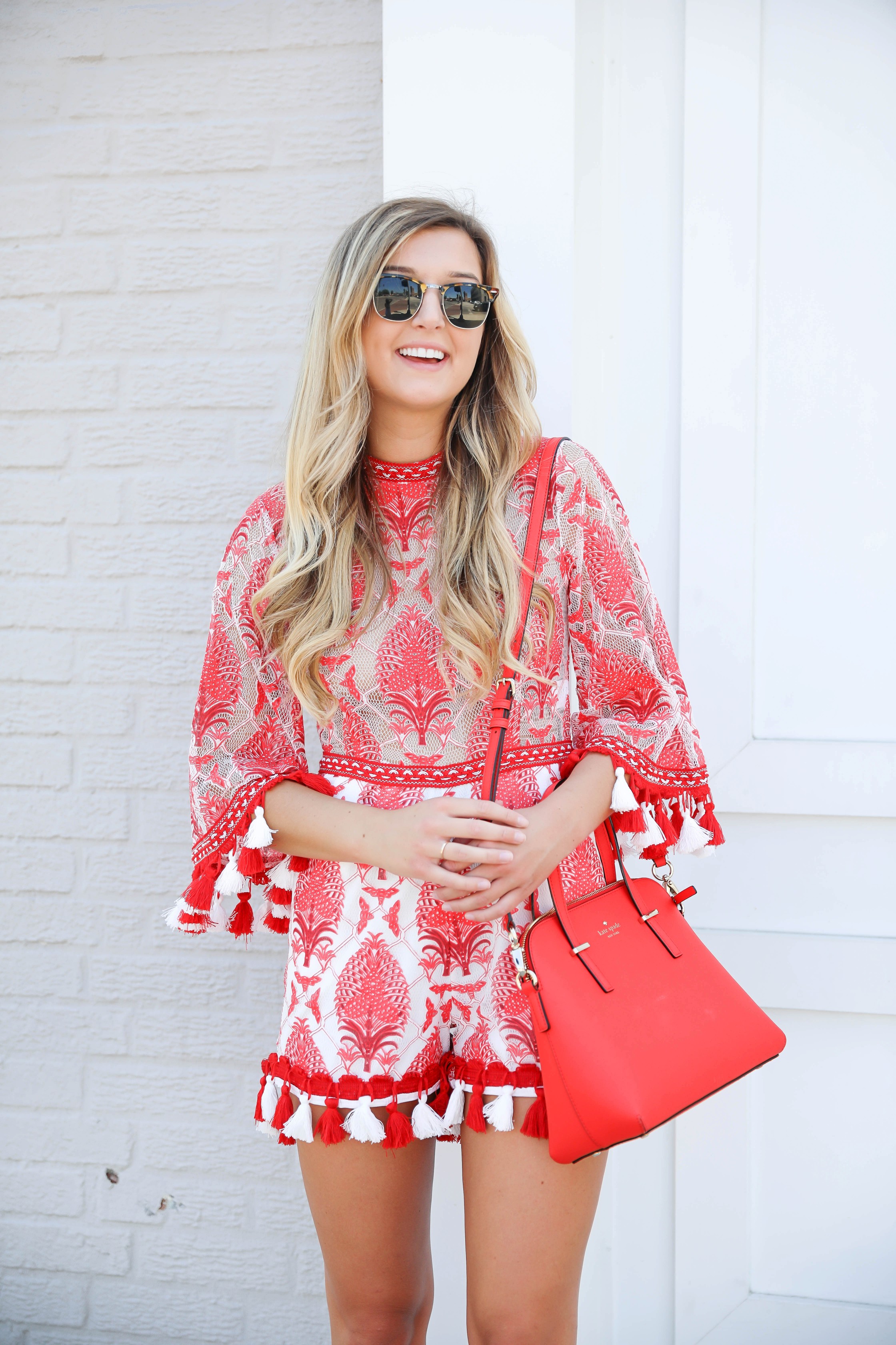 Red and white tassel lace romper from ebay! This is the perfect summer romper, I love the tassels around the sleeves and legs! How cute would this be on the beach? Kate spade red purse styled with this romper! Details on kansas city fashion blog daily dose of charm by lauren lindmark