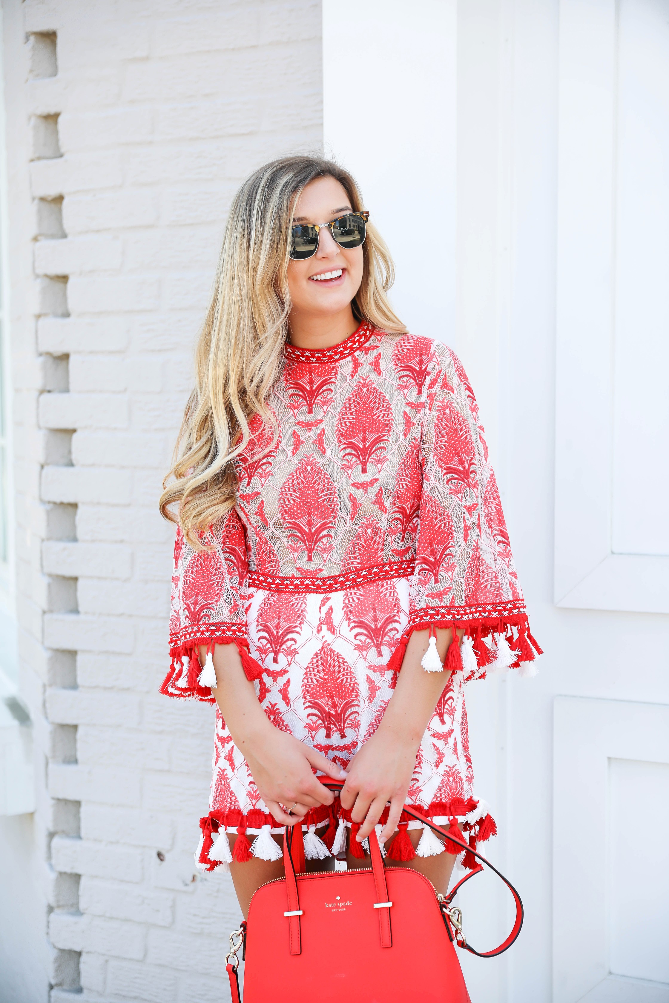 Red and white tassel lace romper from ebay! This is the perfect summer romper, I love the tassels around the sleeves and legs! How cute would this be on the beach? Kate spade red purse styled with this romper! Details on kansas city fashion blog daily dose of charm by lauren lindmark