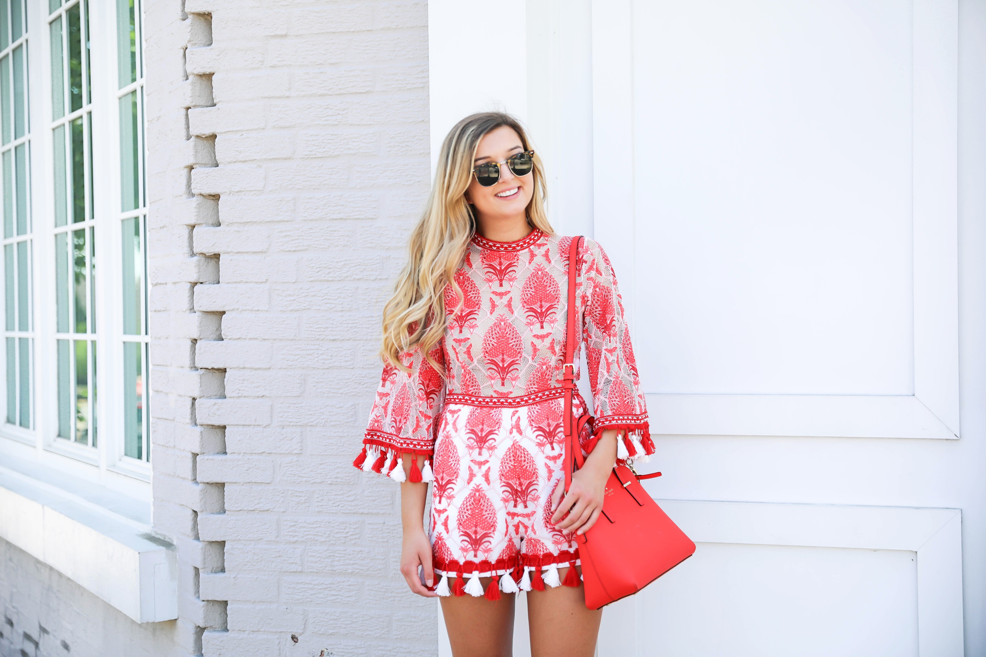 Red and white tassel lace romper from ebay! This is the perfect summer romper, I love the tassels around the sleeves and legs! How cute would this be on the beach? Kate spade red purse styled with this romper! Details on kansas city fashion blog daily dose of charm by lauren lindmark