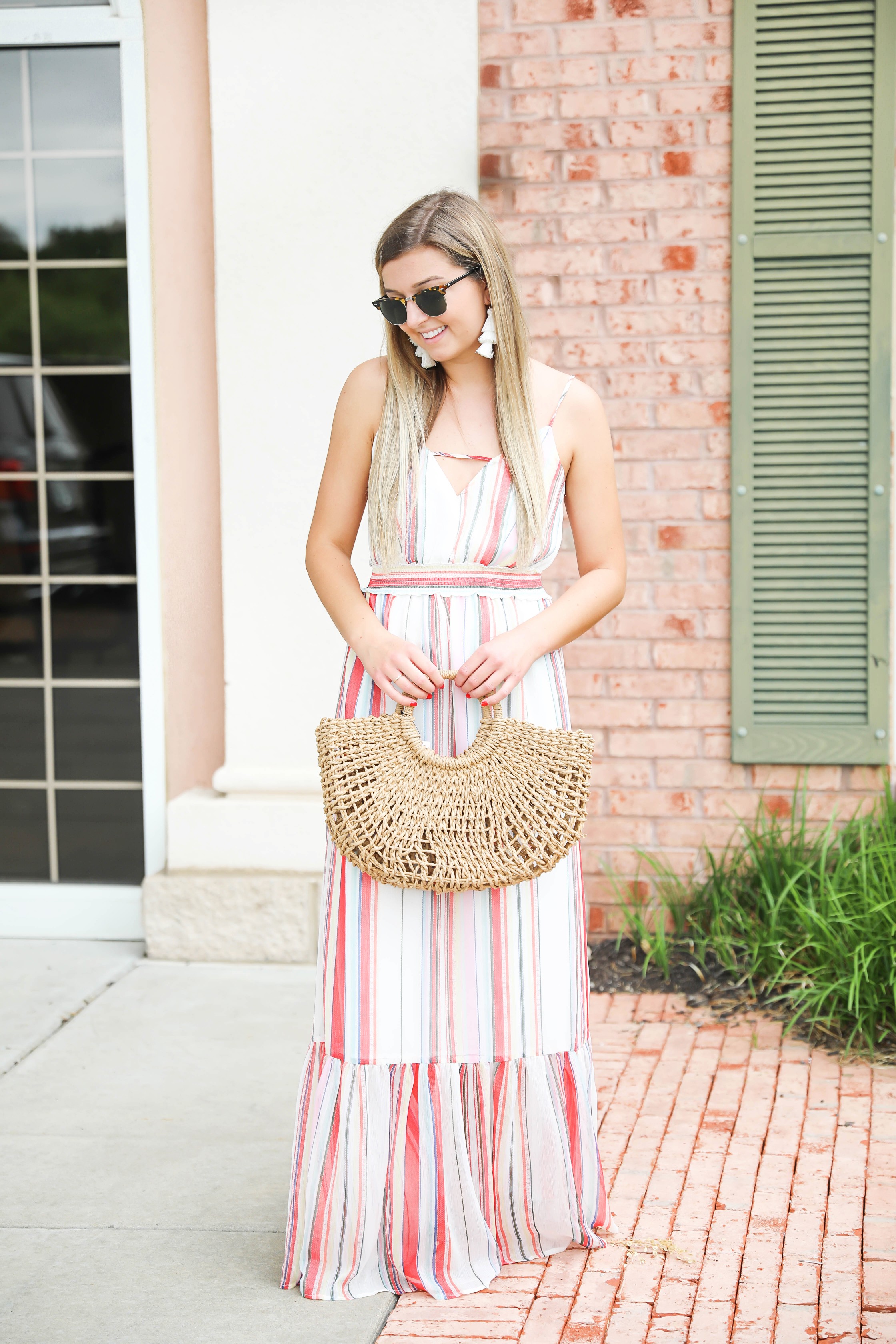 Striped summer maxi dress from revolve! Cute summer fashion and easy outfit ideas! Paired with my favorite straw bag on my blog daily dose of charm by lauren lindmark 