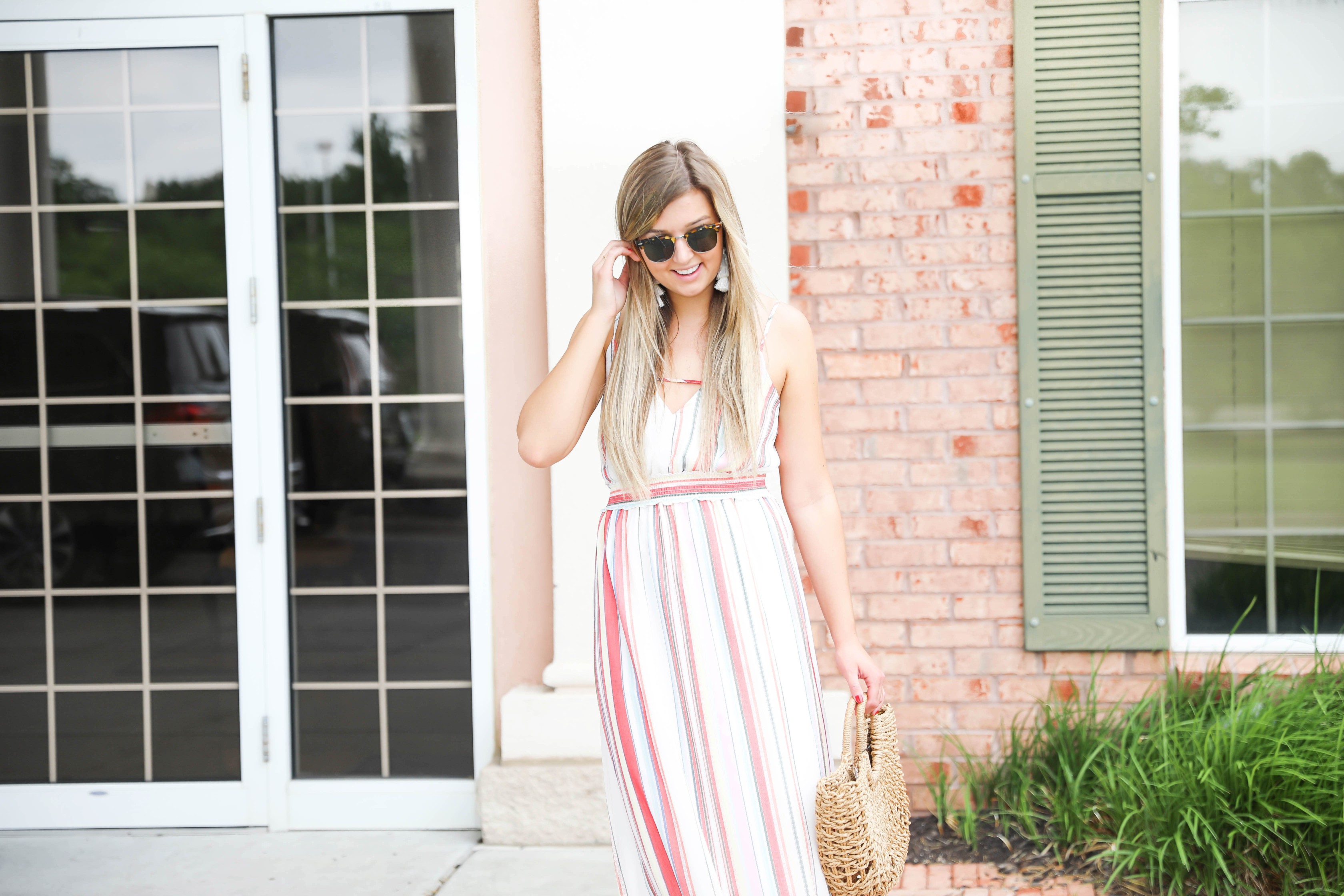 Striped summer maxi dress from revolve! Cute summer fashion and easy outfit ideas! Paired with my favorite straw bag on my blog daily dose of charm by lauren lindmark