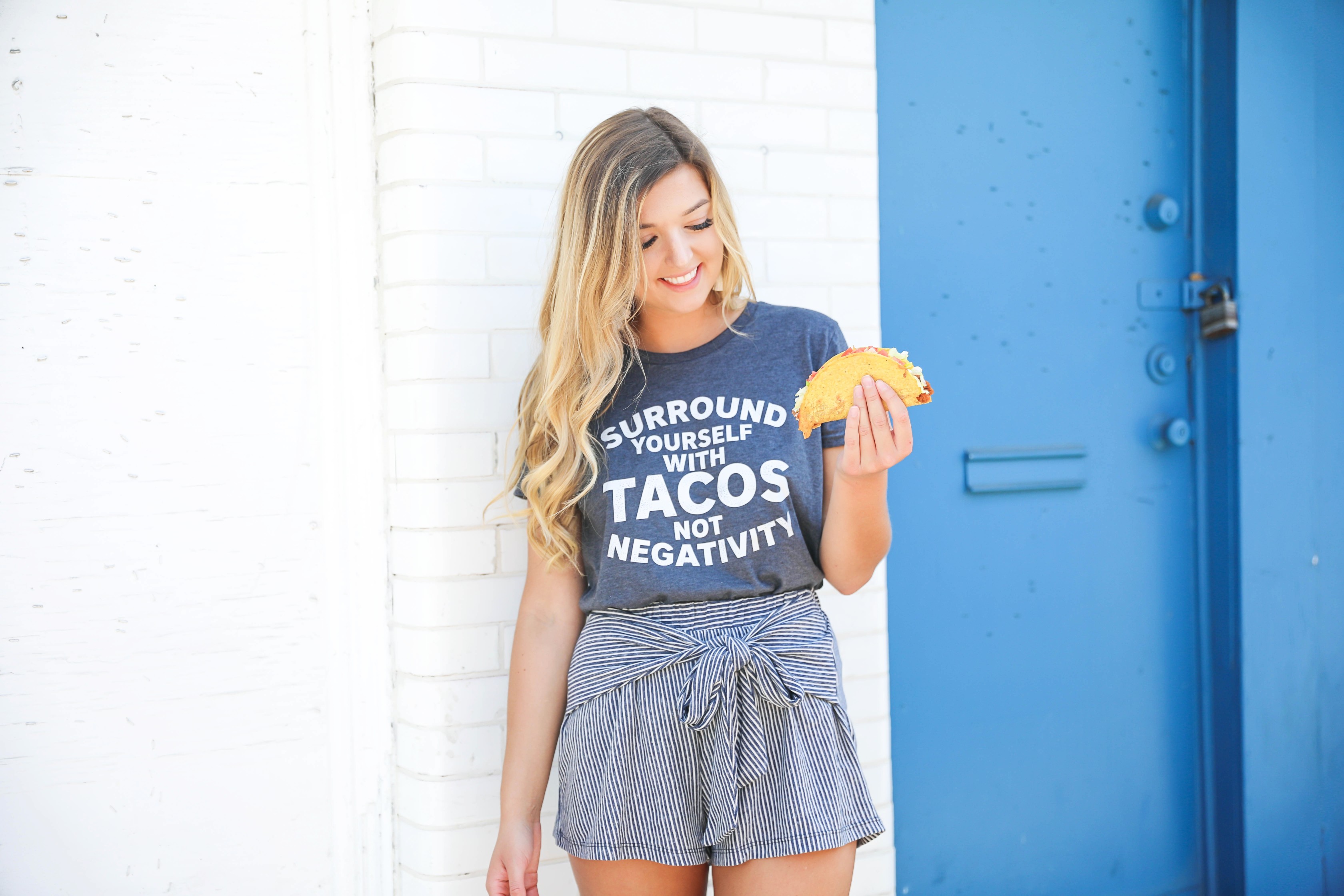 Surround yourself with tacos, not negativity. This is the cutest taco tee! I have been loving for a cute taco tshirt and this one is adorable with my striped cotton shorts! Tied shorts are so in right now! Summer fashion details on the blog daily dose of charm by lauren lindmark