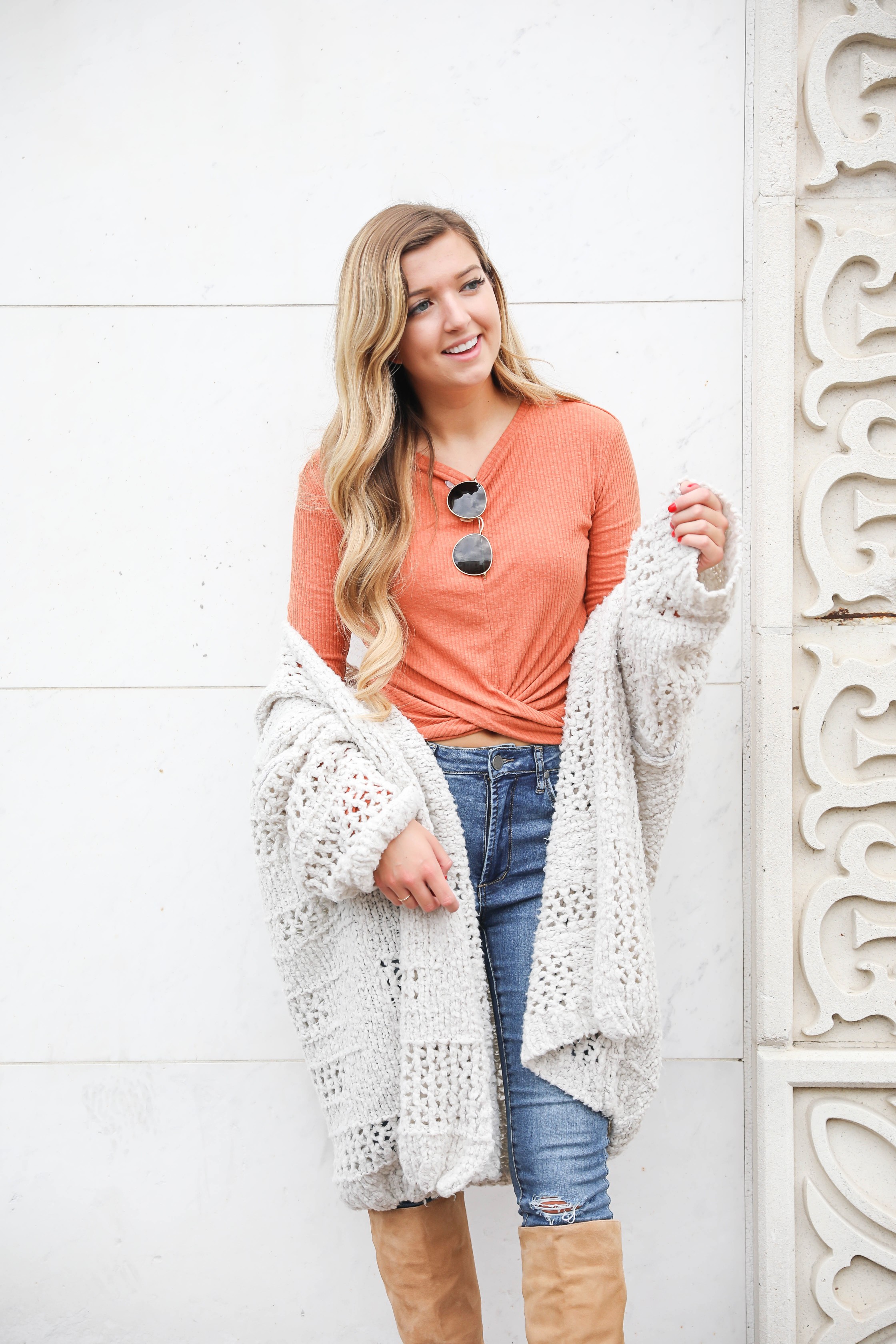 Orange twist top featured in the Nordstrom Anniversary sale paired with this adorable crochet free people cardigan that is also in the sale! They both come in multiple colors and look adorable with my Articles of Society jeans (on sale for $44) and my Sam Edelman boots that are also in the nordstrom anniversary sale 2018! Cutest fall outfit on daily dose of charm by lauren lindmark