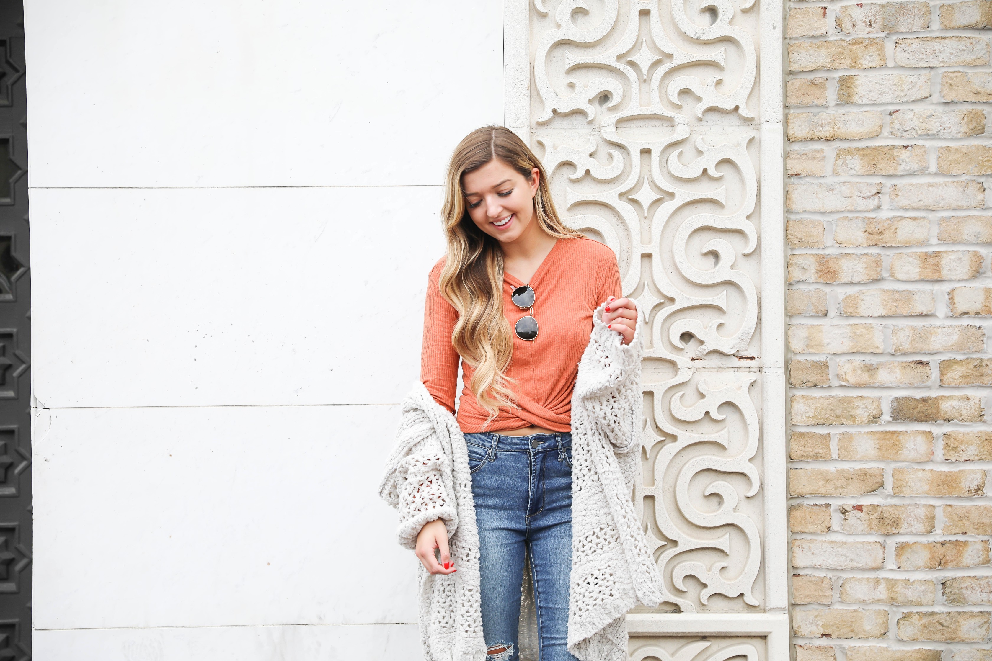 Orange twist top featured in the Nordstrom Anniversary sale paired with this adorable crochet free people cardigan that is also in the sale! They both come in multiple colors and look adorable with my Articles of Society jeans (on sale for $44) and my Sam Edelman boots that are also in the nordstrom anniversary sale 2018! Cutest fall outfit on daily dose of charm by lauren lindmark