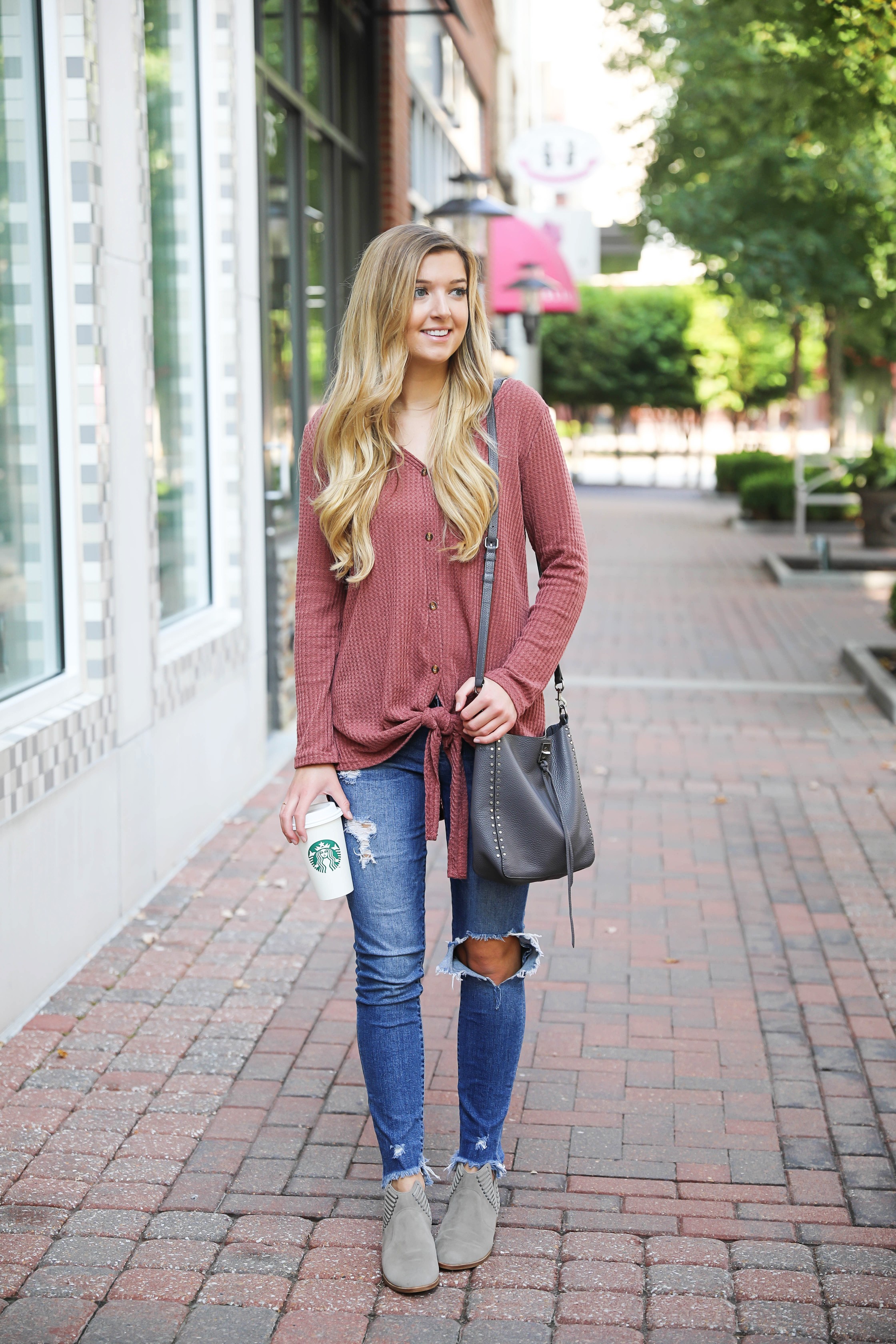 Burgundy waffle top! These waffle tops are all the rage, I love when they are tied on the end! It comes in a ton of cute fall colors. I paired mine with ripped denim jeans and this cute Rebecca Minkoff purse! Such a cute fall outfit for back to school! Details on fashion blog daily dose of charm by lauren lindmark