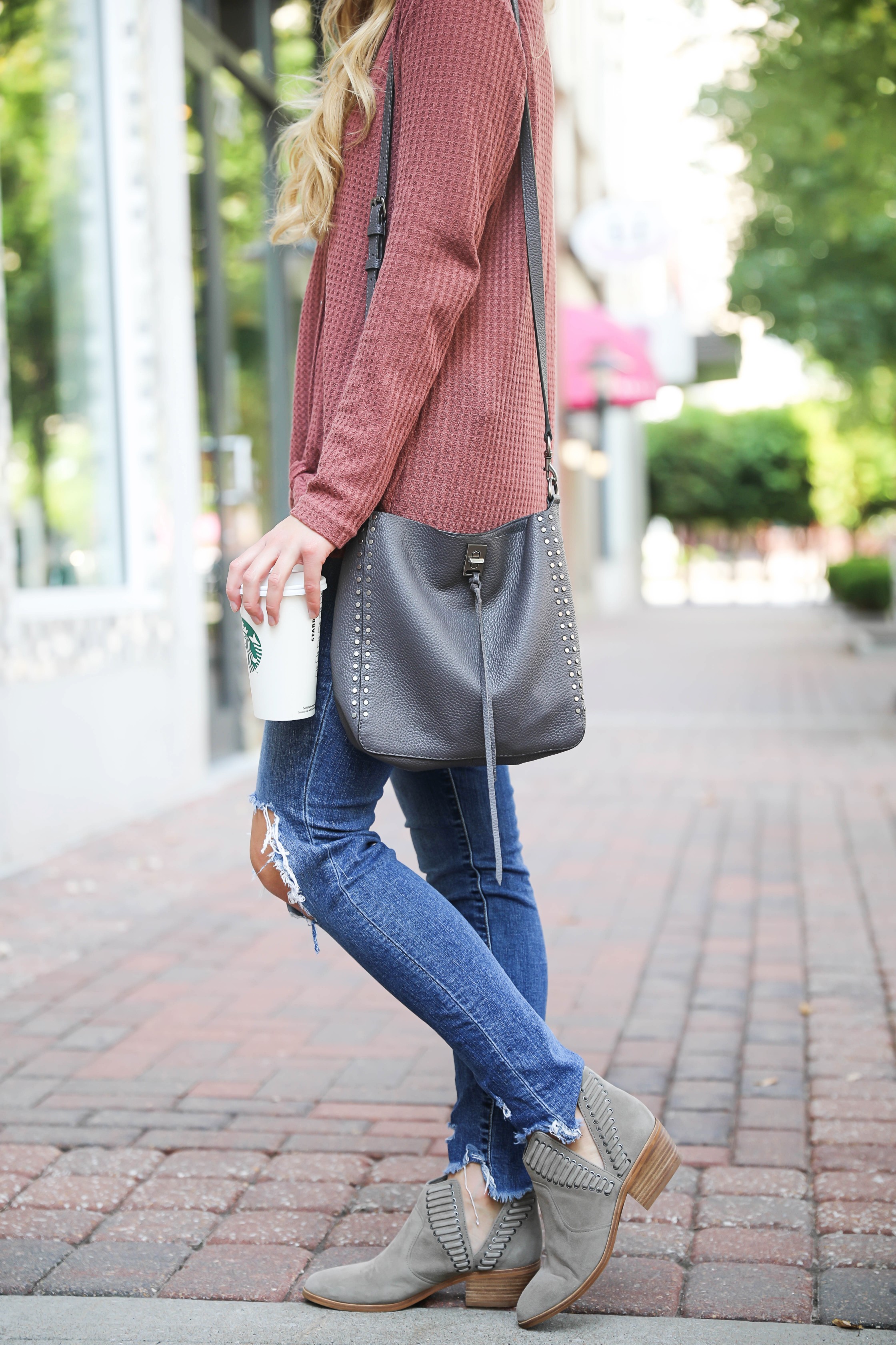 Burgundy waffle top! These waffle tops are all the rage, I love when they are tied on the end! It comes in a ton of cute fall colors. I paired mine with ripped denim jeans and this cute Rebecca Minkoff purse! Such a cute fall outfit for back to school! Details on fashion blog daily dose of charm by lauren lindmark