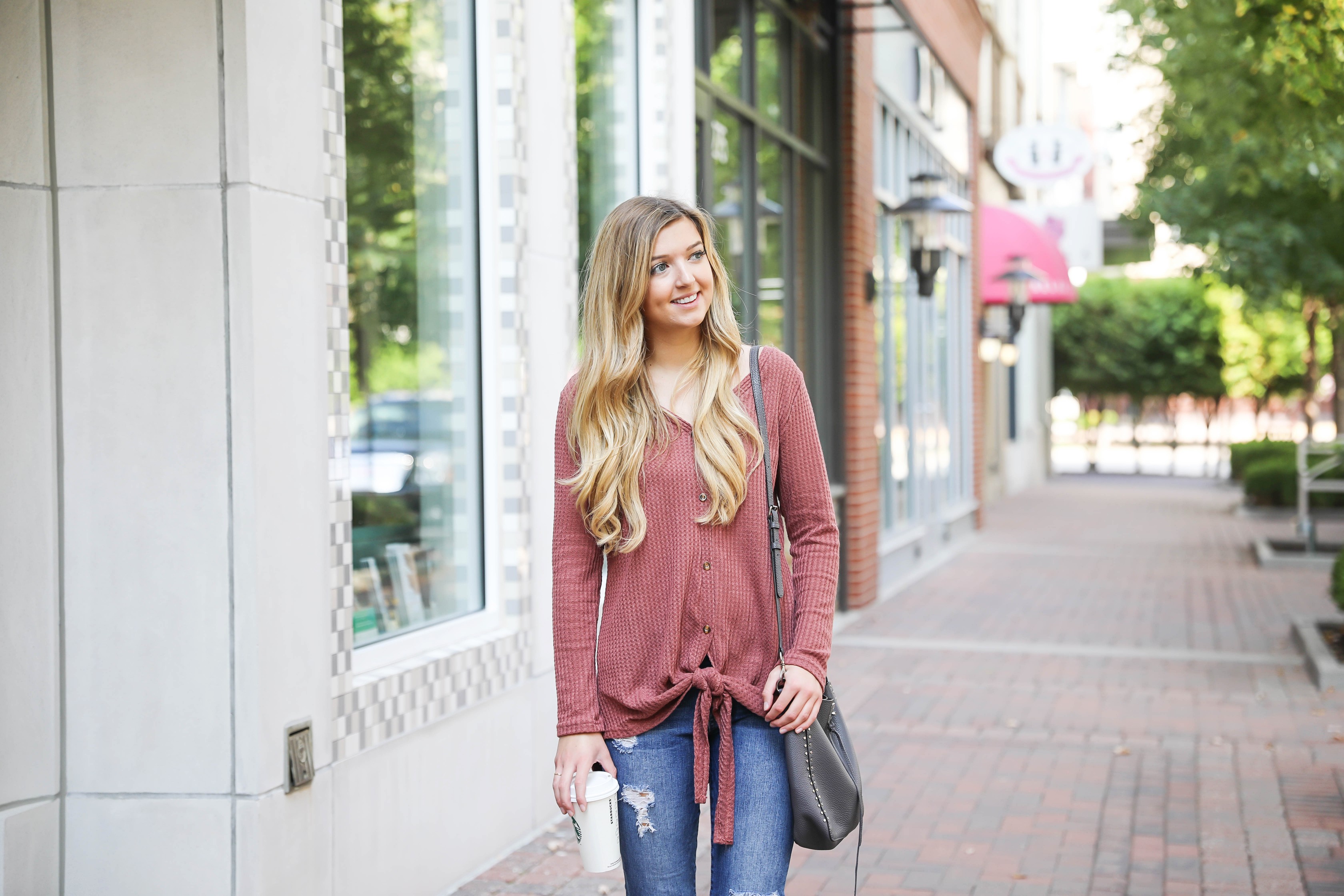 Burgundy waffle top! These waffle tops are all the rage, I love when they are tied on the end! It comes in a ton of cute fall colors. I paired mine with ripped denim jeans and this cute Rebecca Minkoff purse! Such a cute fall outfit for back to school! Details on fashion blog daily dose of charm by lauren lindmark