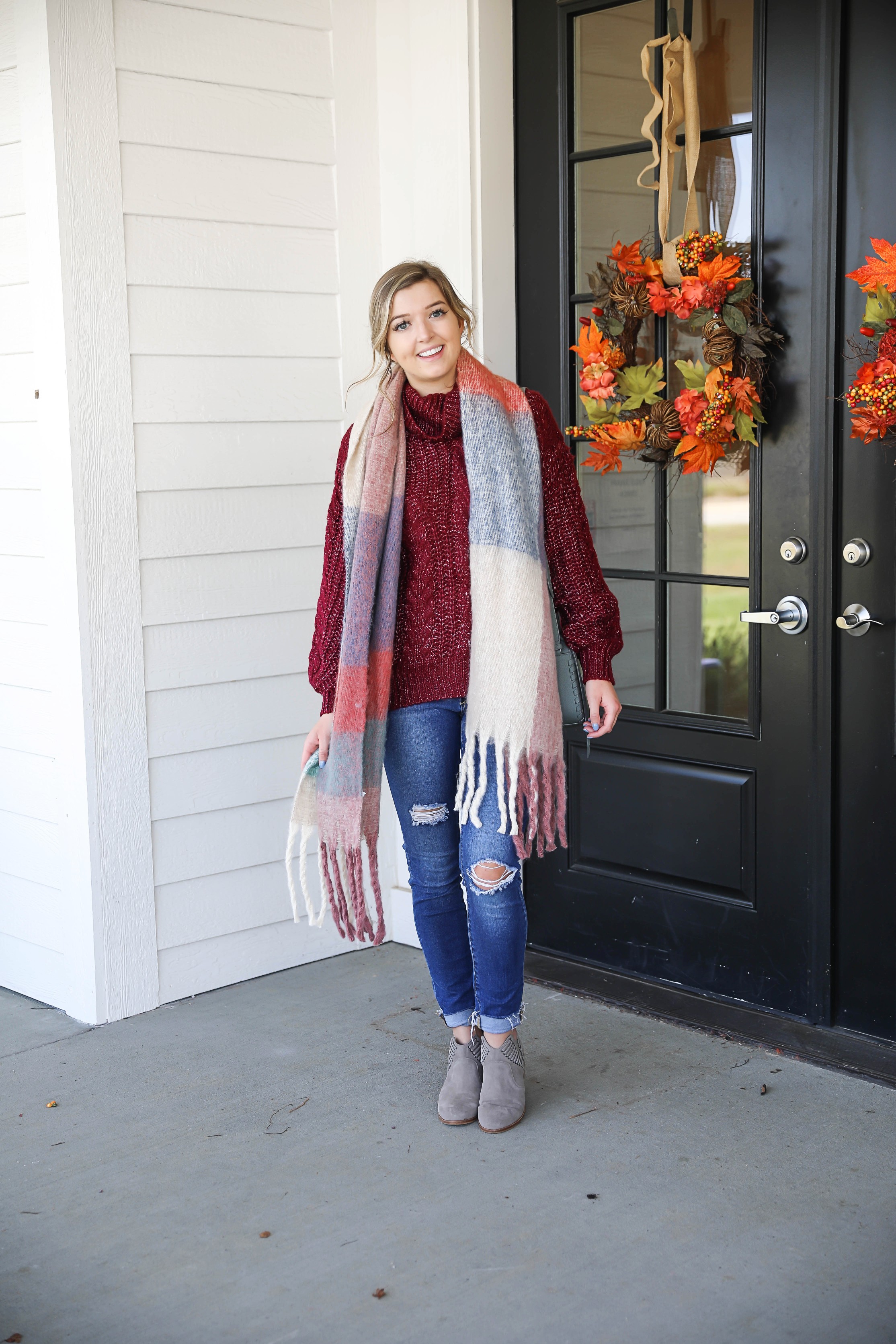 Burgundy knit sweater with the softest plaid oversized scarf! Paired with ripped denim jeans and my vince camuto booties! This is the perfect fall outfit you need in your closet! A few pieces are from Red Dress Boutique which is the best online store, especially for fall clothes! Details on fashion blog daily dose of charm by lauren lindmark