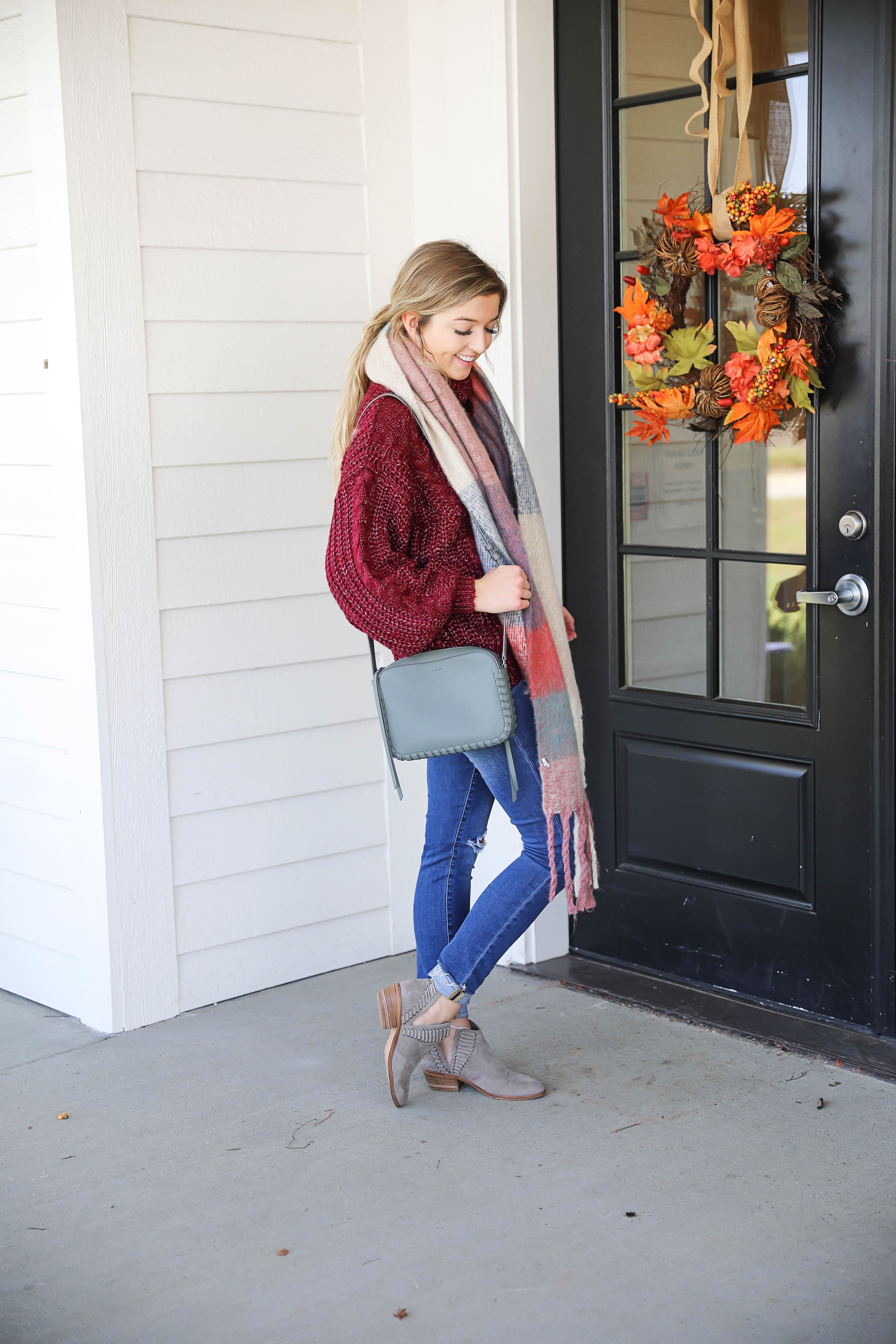 Burgundy knit sweater with the softest plaid oversized scarf! Paired with ripped denim jeans and my vince camuto booties! This is the perfect fall outfit you need in your closet! A few pieces are from Red Dress Boutique which is the best online store, especially for fall clothes! Details on fashion blog daily dose of charm by lauren lindmark