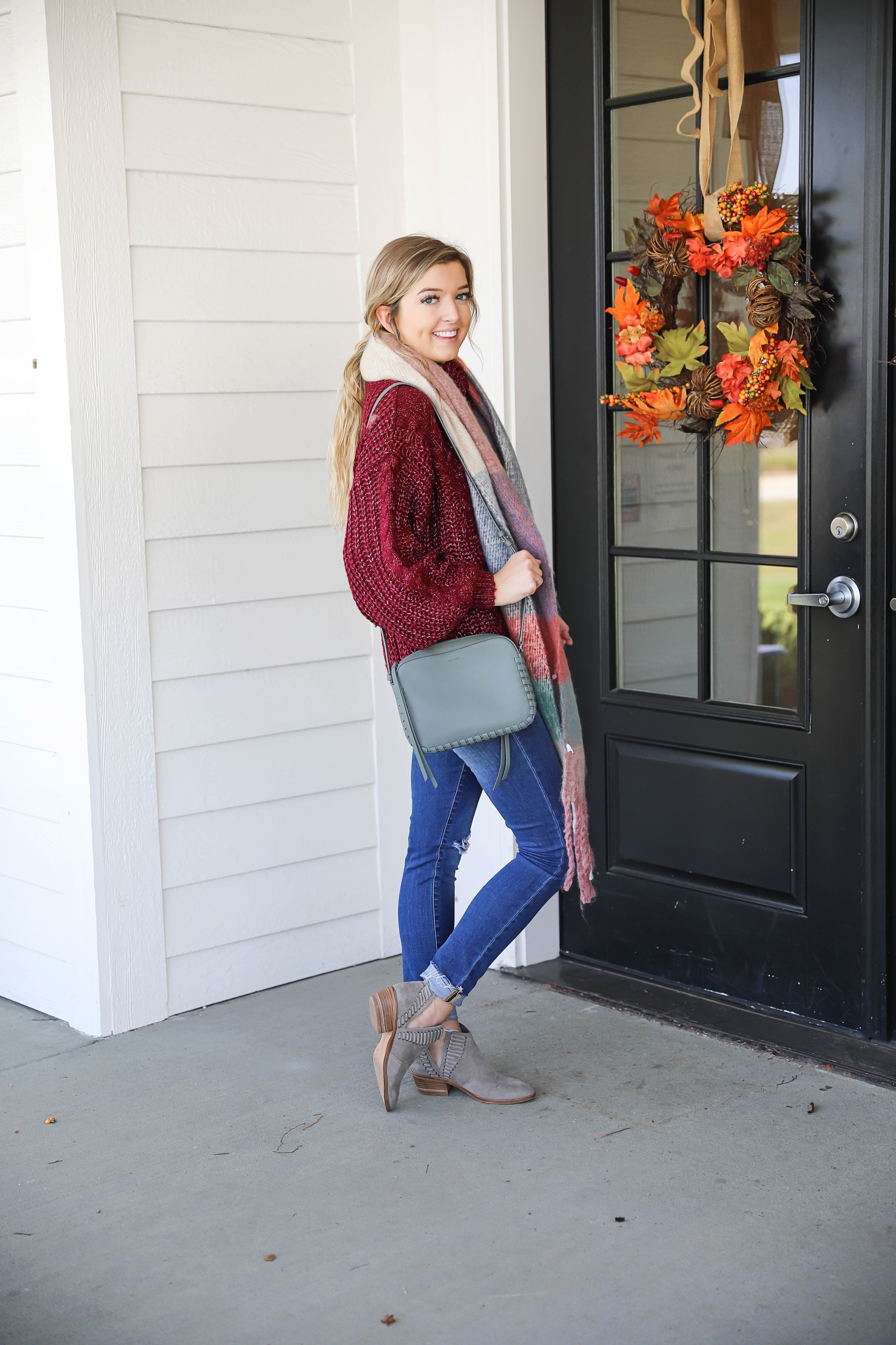 Burgundy knit sweater with the softest plaid oversized scarf! Paired with ripped denim jeans and my vince camuto booties! This is the perfect fall outfit you need in your closet! A few pieces are from Red Dress Boutique which is the best online store, especially for fall clothes! Details on fashion blog daily dose of charm by lauren lindmark