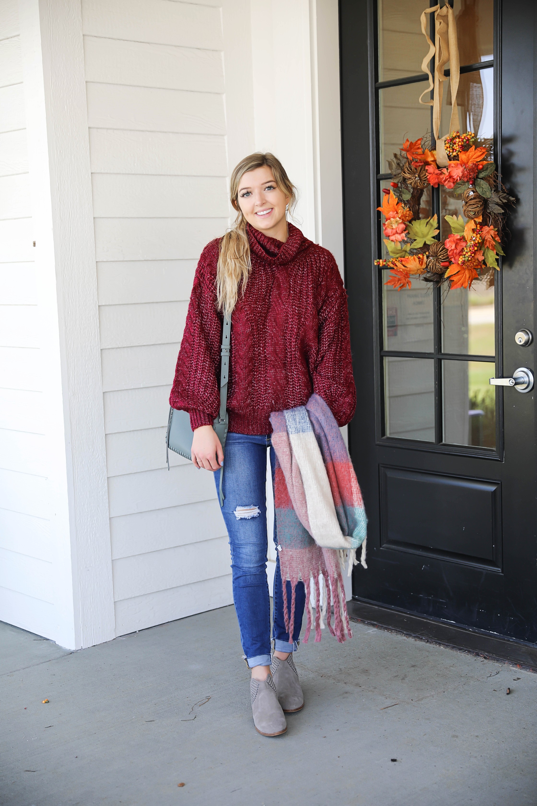 Burgundy knit sweater with the softest plaid oversized scarf! Paired with ripped denim jeans and my vince camuto booties! This is the perfect fall outfit you need in your closet! A few pieces are from Red Dress Boutique which is the best online store, especially for fall clothes! Details on fashion blog daily dose of charm by lauren lindmark