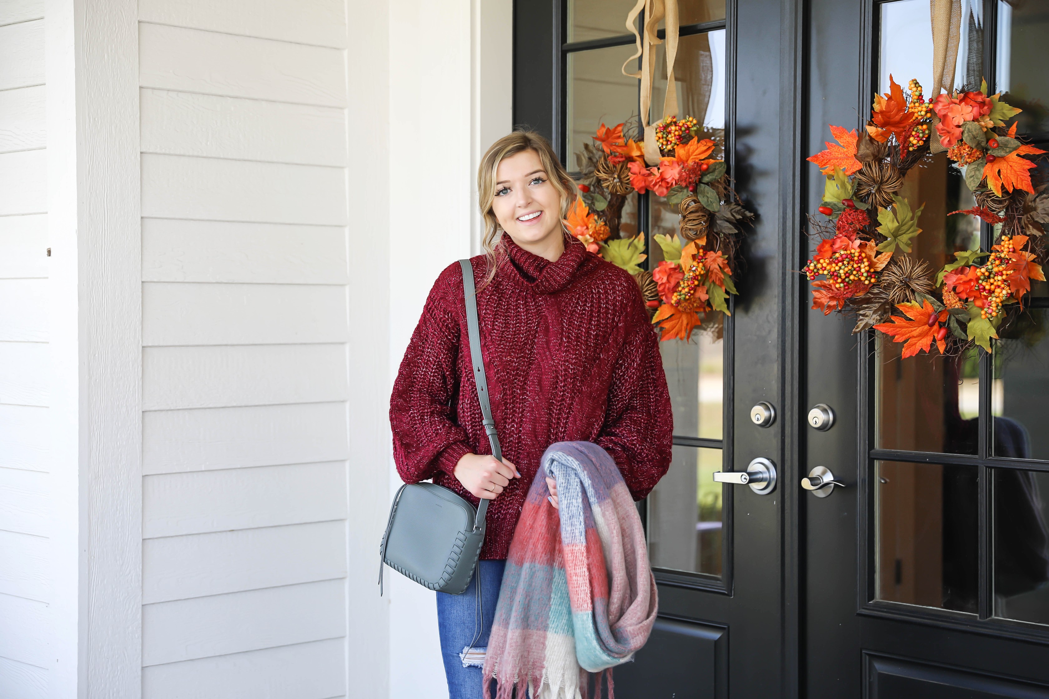 Burgundy knit sweater with the softest plaid oversized scarf! Paired with ripped denim jeans and my vince camuto booties! This is the perfect fall outfit you need in your closet! A few pieces are from Red Dress Boutique which is the best online store, especially for fall clothes! Details on fashion blog daily dose of charm by lauren lindmark