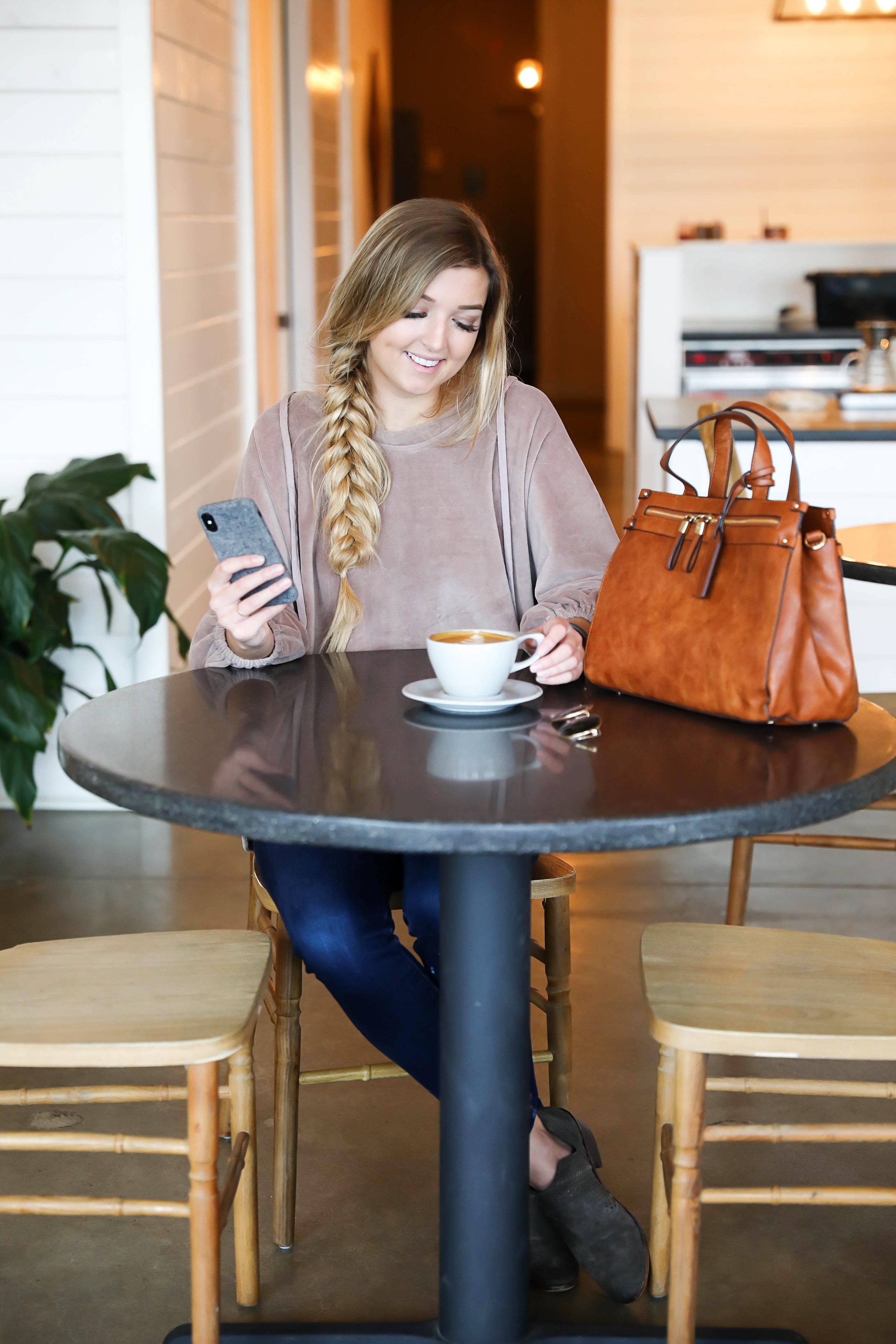 How I boosted my Instagram Engagement by 50%! My tips and tricks for growing an authentic following on Instagram and boosting your likes! Coffee shop date photoshoot! I love this herringbone fall phone case with my Sole Society faux leather bag! I love this velvet sweatshirt with my fishtail braid! Details on fashion blog daily dose of charm by lauren lindmark