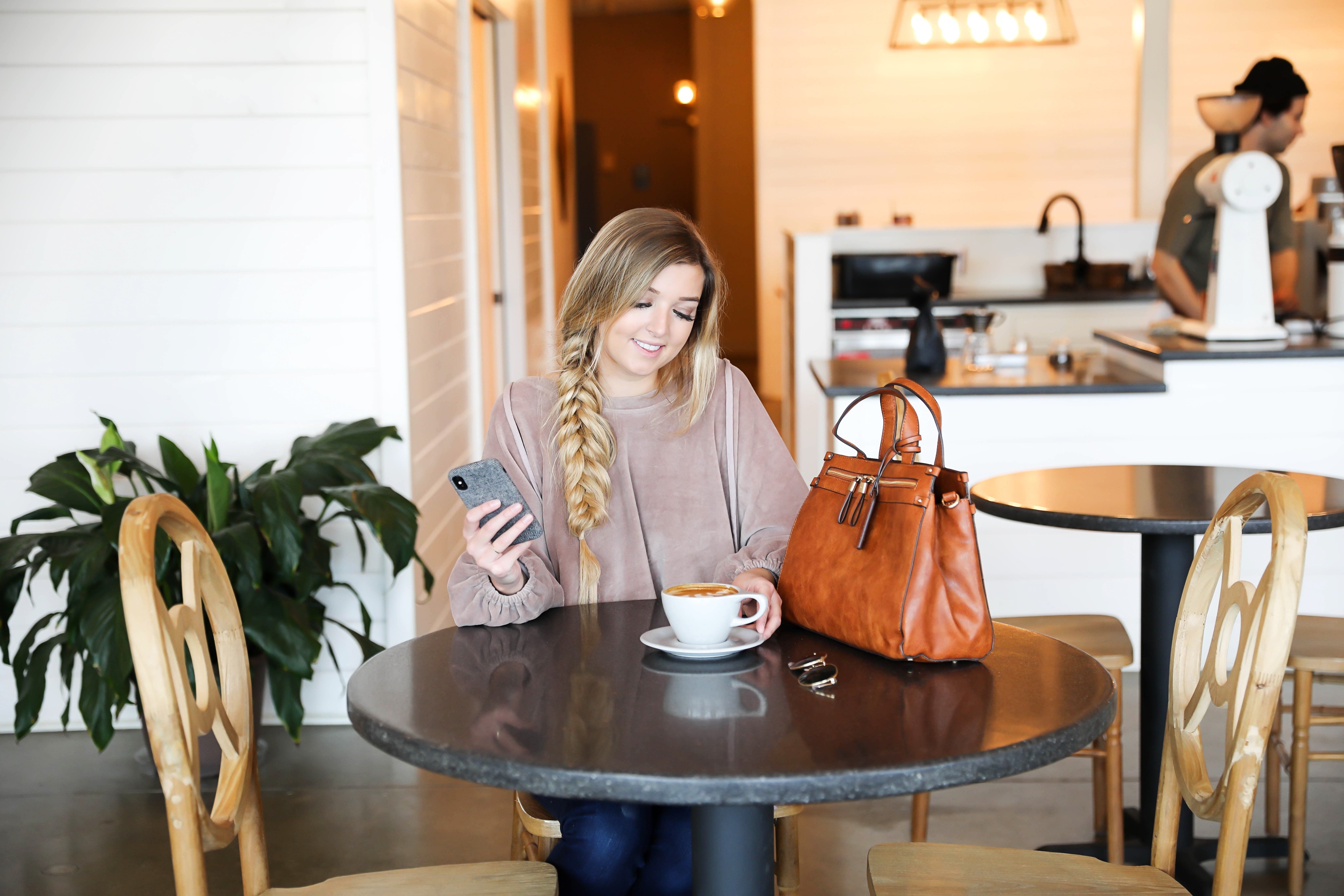 How I boosted my Instagram Engagement by 50%! My tips and tricks for growing an authentic following on Instagram and boosting your likes! Coffee shop date photoshoot! I love this herringbone fall phone case with my Sole Society faux leather bag! I love this velvet sweatshirt with my fishtail braid! Details on fashion blog daily dose of charm by lauren lindmark