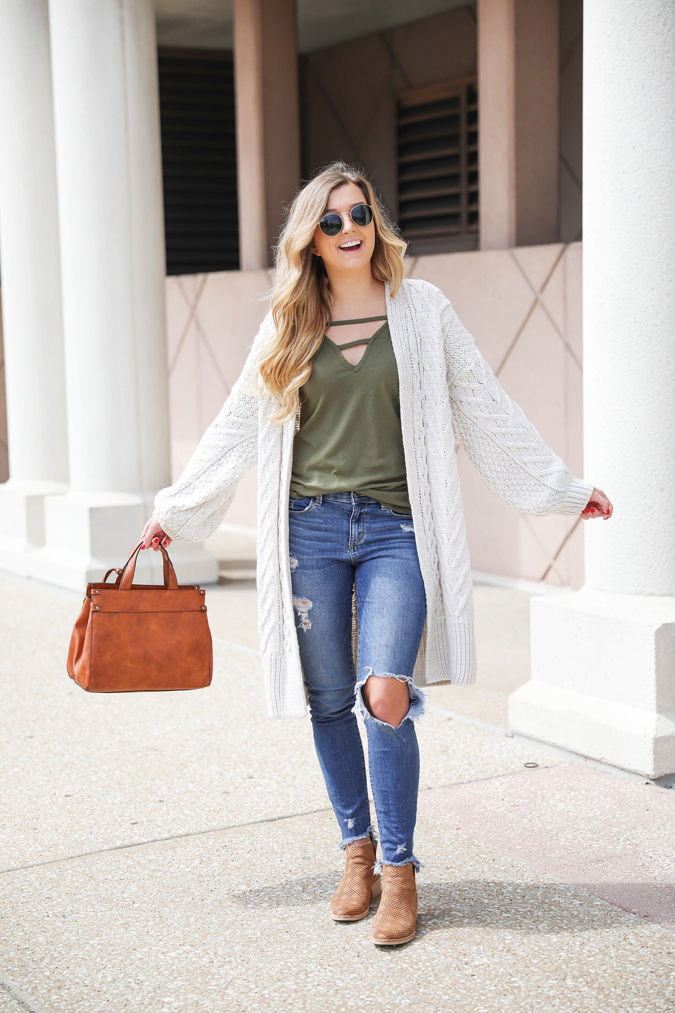 Long cream knit cardigan with a fun olive tank! Paired with my favorite ripped jeans and this super cute faux leather sole society bag that's perfect for fall! These are also the best booties for fall! Details on fashion blog daily dose of charm by Lauren Lindmark