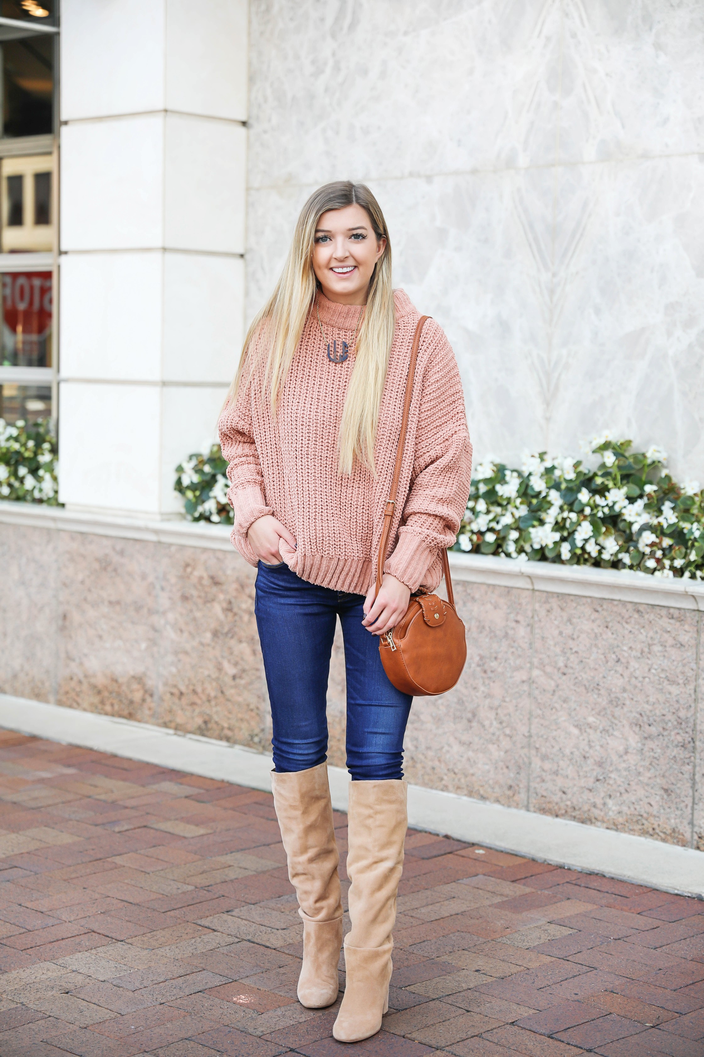 Oversized soft pink sweater! I love a cute inexpensive sweater, especially when it is comfy too! I paired mine with dark jeans and tan knee high boots by Sam Edelman! I also threw on my tortoise shell monogram necklace and faux leather bag! Details on fashion blog daily dose of charm by lauren lindmark