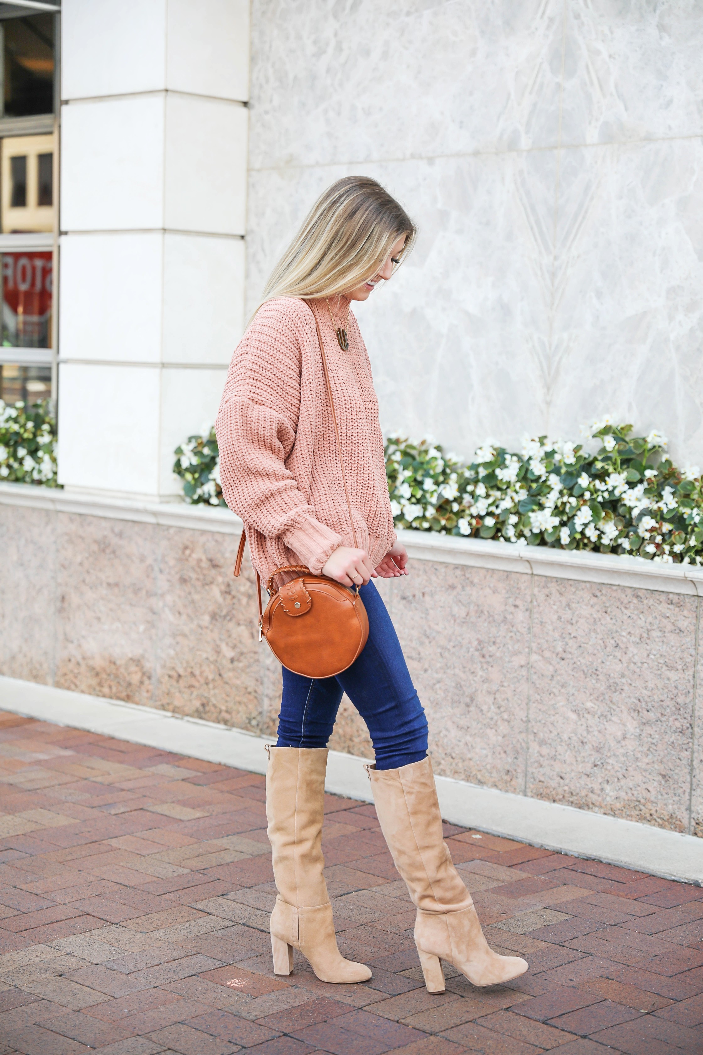 Oversized soft pink sweater! I love a cute inexpensive sweater, especially when it is comfy too! I paired mine with dark jeans and tan knee high boots by Sam Edelman! I also threw on my tortoise shell monogram necklace and faux leather bag! Details on fashion blog daily dose of charm by lauren lindmark