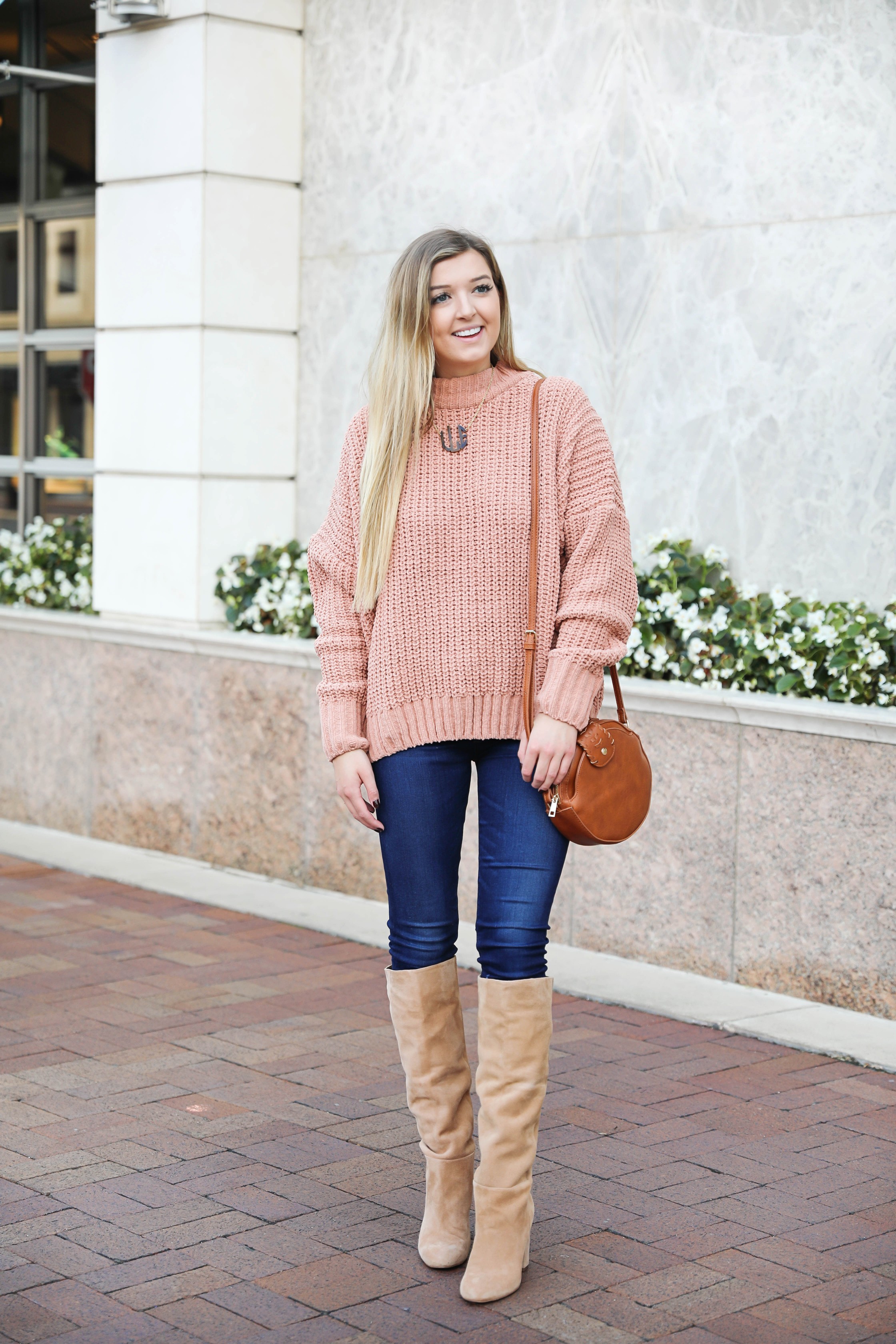 Oversized soft pink sweater! I love a cute inexpensive sweater, especially when it is comfy too! I paired mine with dark jeans and tan knee high boots by Sam Edelman! I also threw on my tortoise shell monogram necklace and faux leather bag! Details on fashion blog daily dose of charm by lauren lindmark