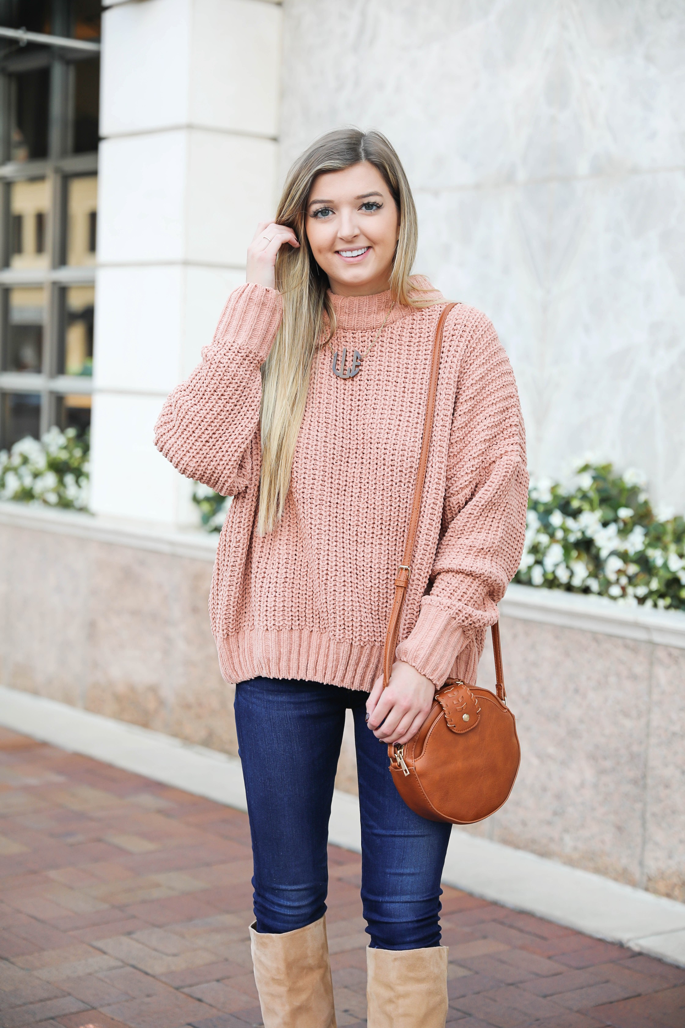 Oversized soft pink sweater! I love a cute inexpensive sweater, especially when it is comfy too! I paired mine with dark jeans and tan knee high boots by Sam Edelman! I also threw on my tortoise shell monogram necklace and faux leather bag! Details on fashion blog daily dose of charm by lauren lindmark