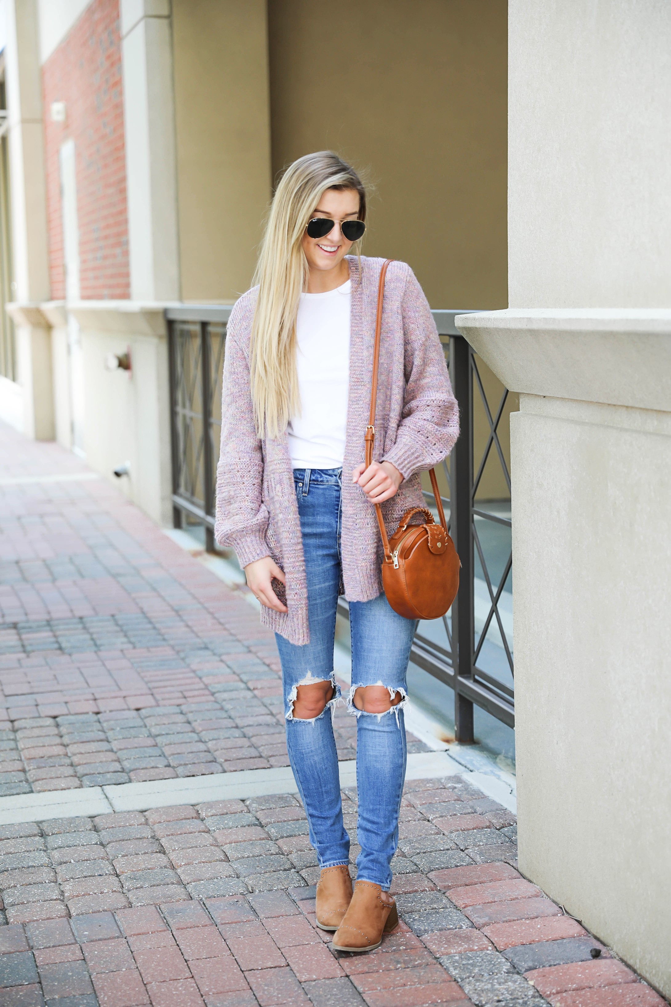Pink knit cardigan with ripped denim jeans! I paired this look with the cutest pointed toe bootie slides from target! I love Target style, their shoes are so cute! Details on this fall outfit on fashion blog daily dose of charm by lauren lindmark