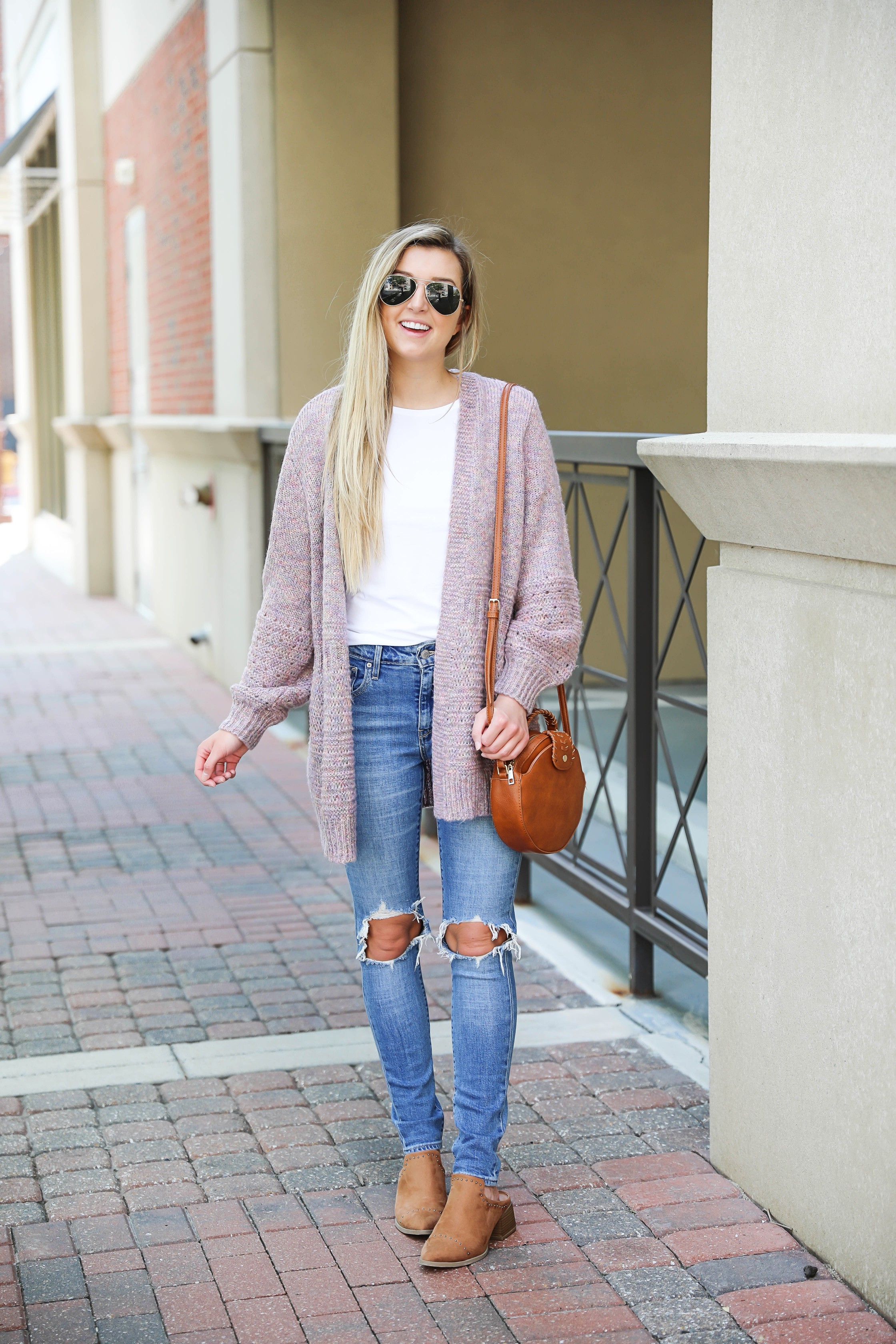 Pink knit cardigan with ripped denim jeans! I paired this look with the cutest pointed toe bootie slides from target! I love Target style, their shoes are so cute! Details on this fall outfit on fashion blog daily dose of charm by lauren lindmark