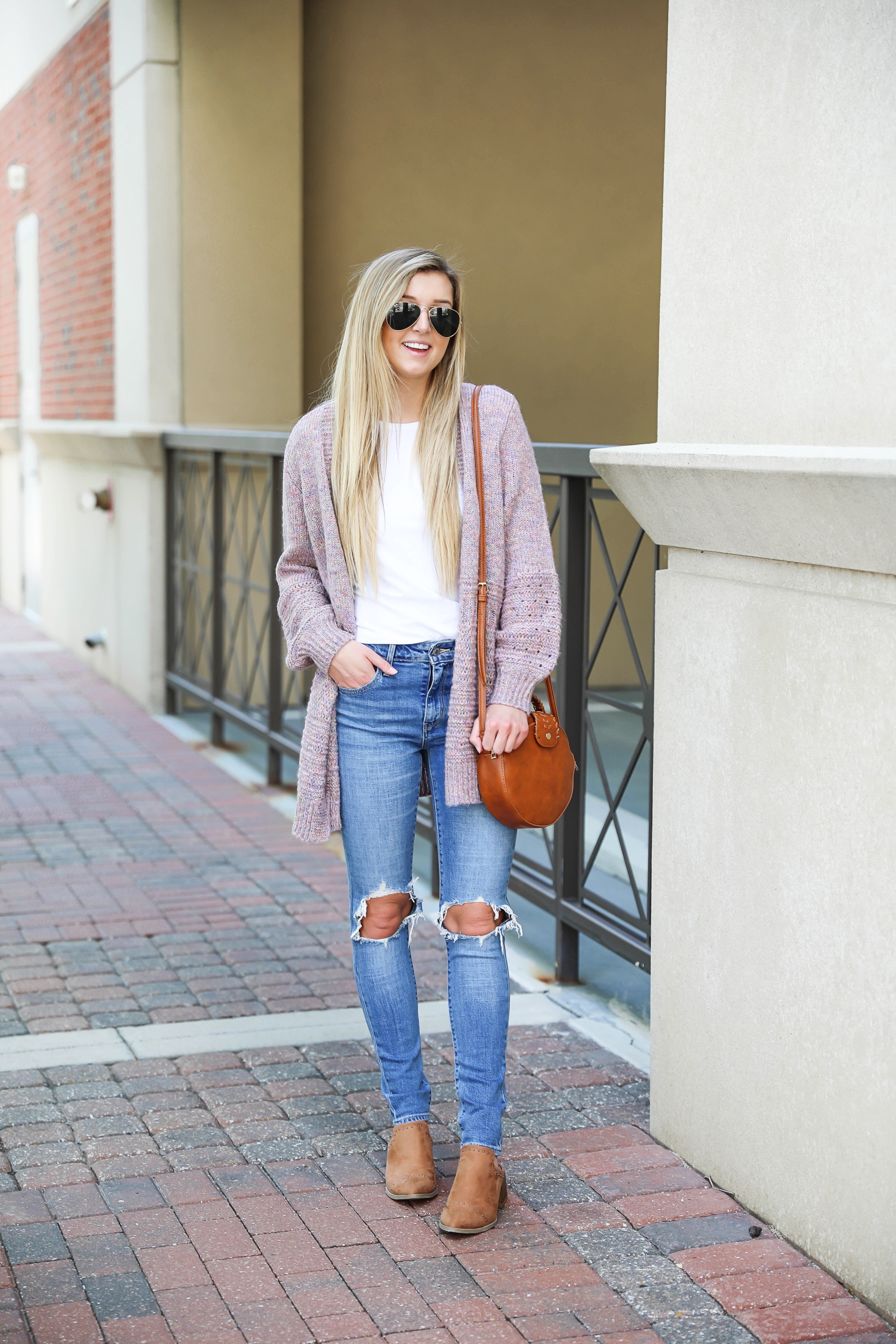 Pink knit cardigan with ripped denim jeans! I paired this look with the cutest pointed toe bootie slides from target! I love Target style, their shoes are so cute! Details on this fall outfit on fashion blog daily dose of charm by lauren lindmark