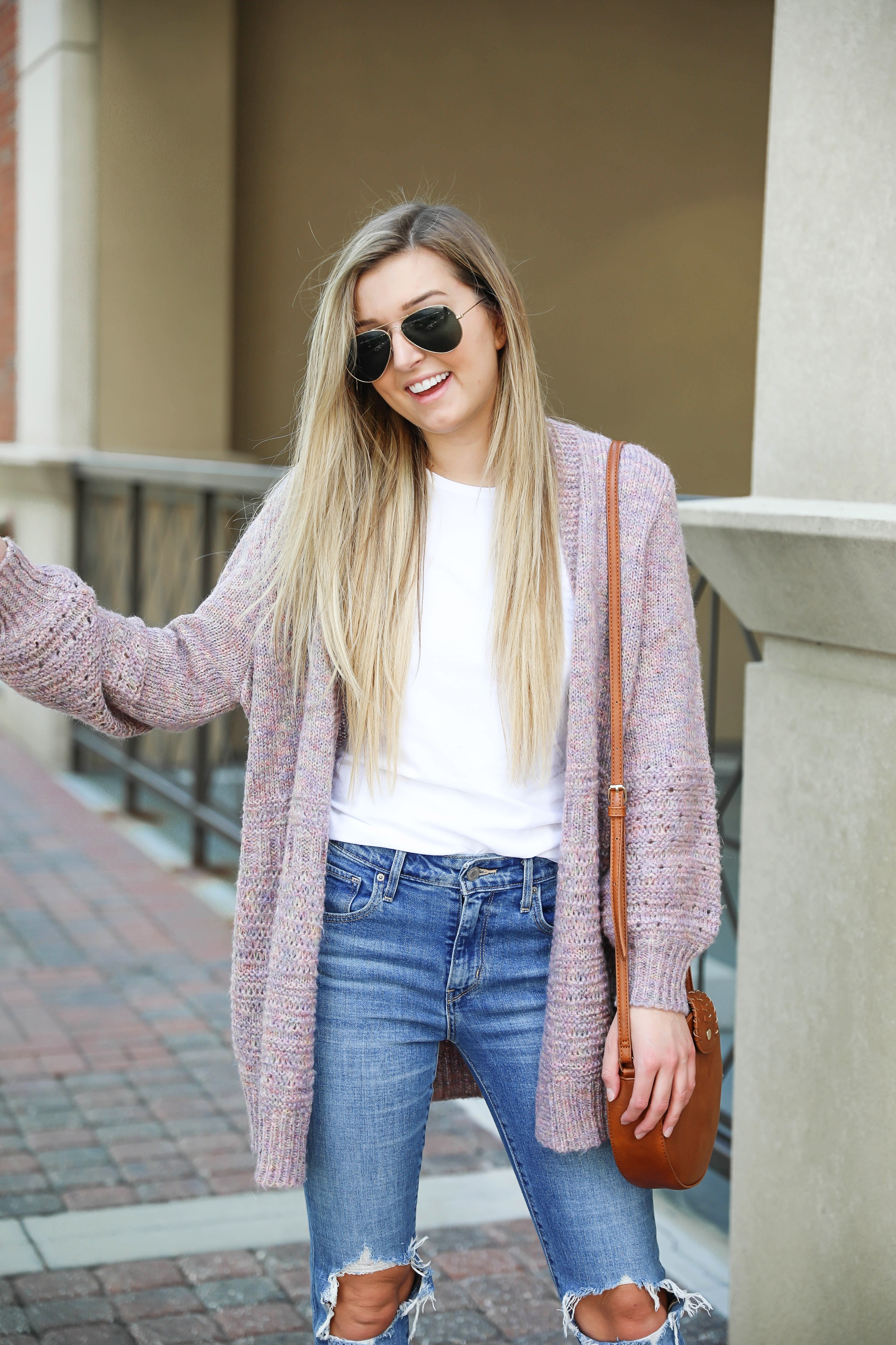 Pink knit cardigan with ripped denim jeans! I paired this look with the cutest pointed toe bootie slides from target! I love Target style, their shoes are so cute! Details on this fall outfit on fashion blog daily dose of charm by lauren lindmark