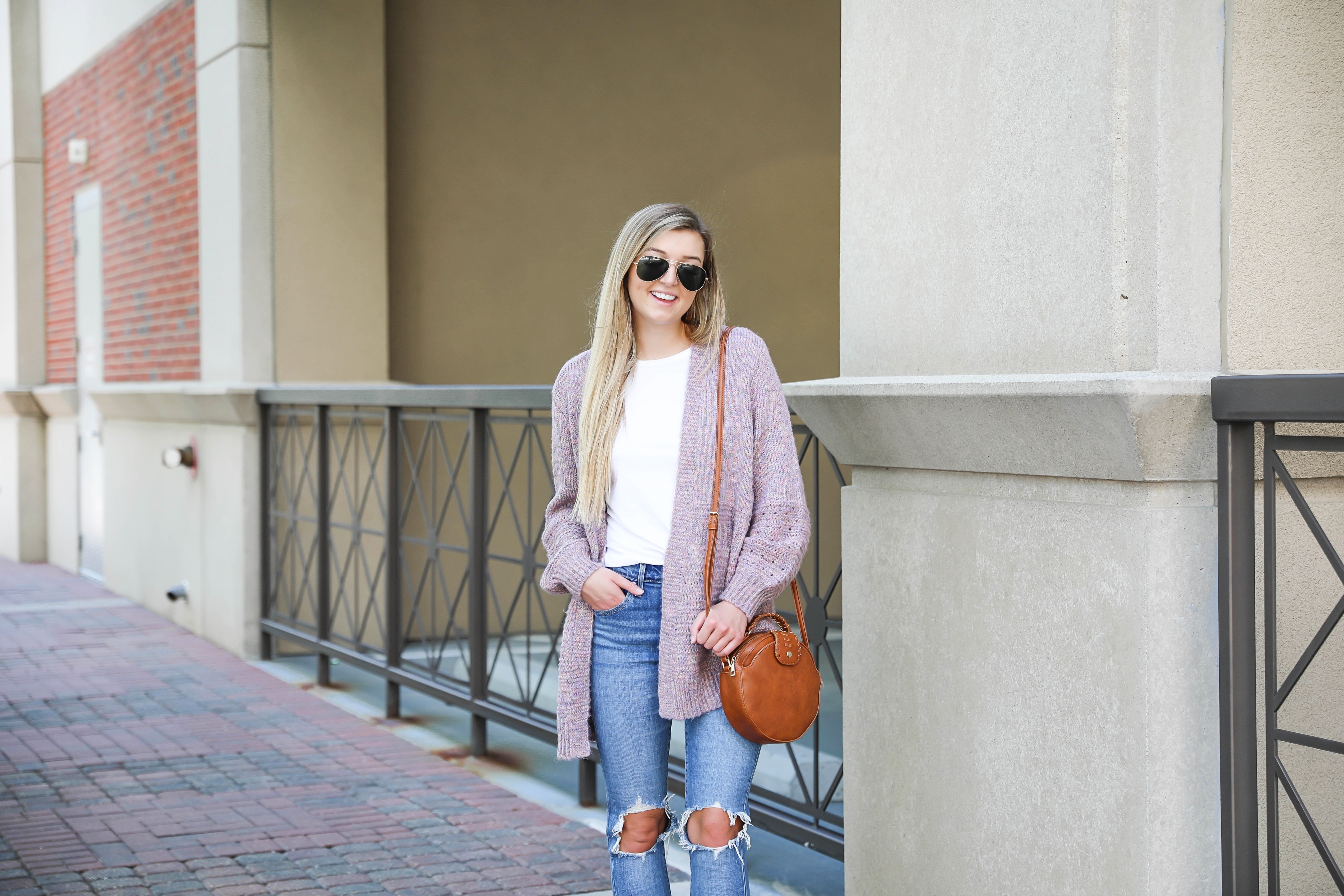 Pink knit cardigan with ripped denim jeans! I paired this look with the cutest pointed toe bootie slides from target! I love Target style, their shoes are so cute! Details on this fall outfit on fashion blog daily dose of charm by lauren lindmark