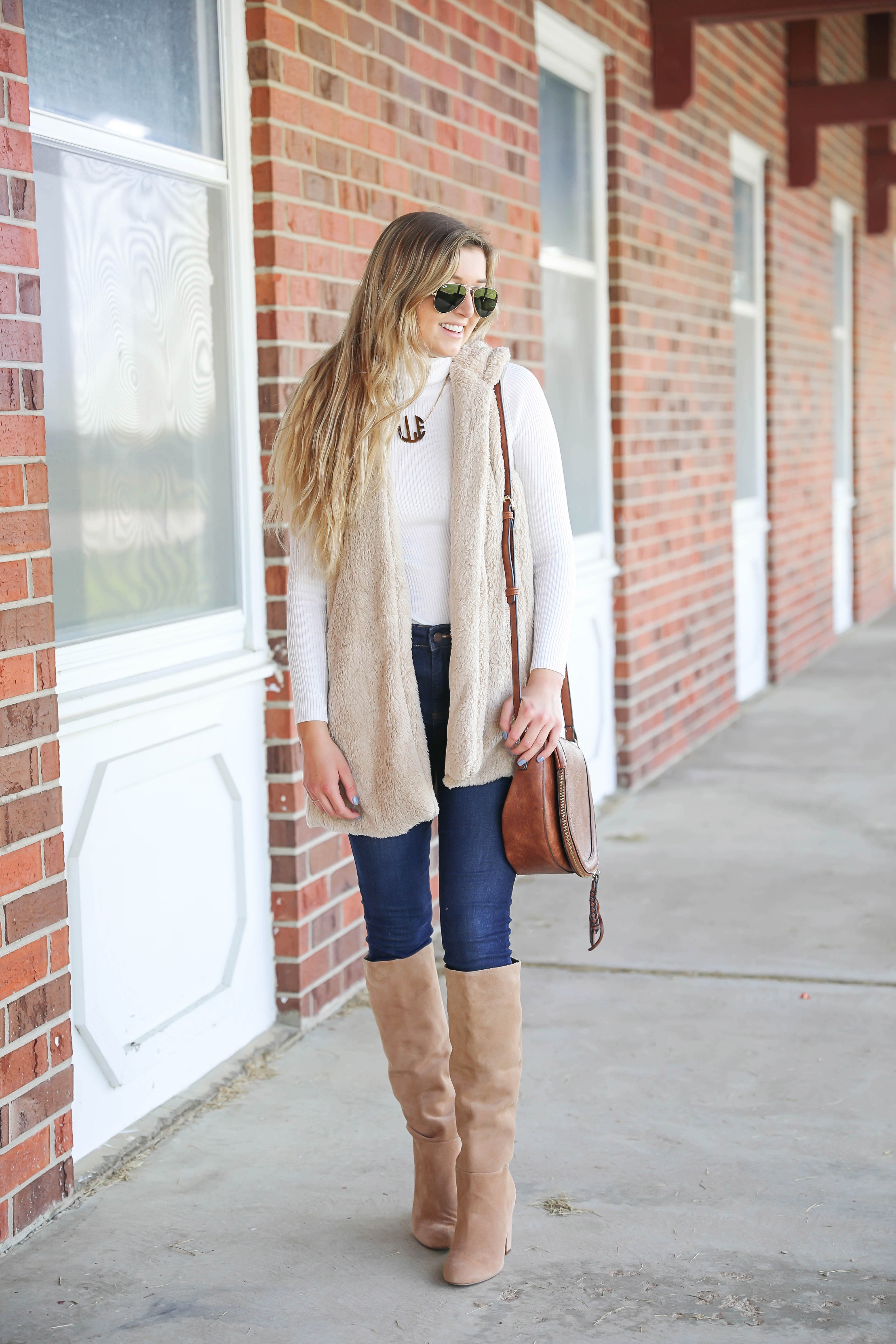 Teddy bear vest for fall! I love soft clothing and this long vest makes for the perfect fall outfit! I paired with a cute white turtleneck and monogram necklace! Plus my favorite shoes for fall are these tan sam edelman boots! Details on fashion blog daily dose of charm by lauren lindmark