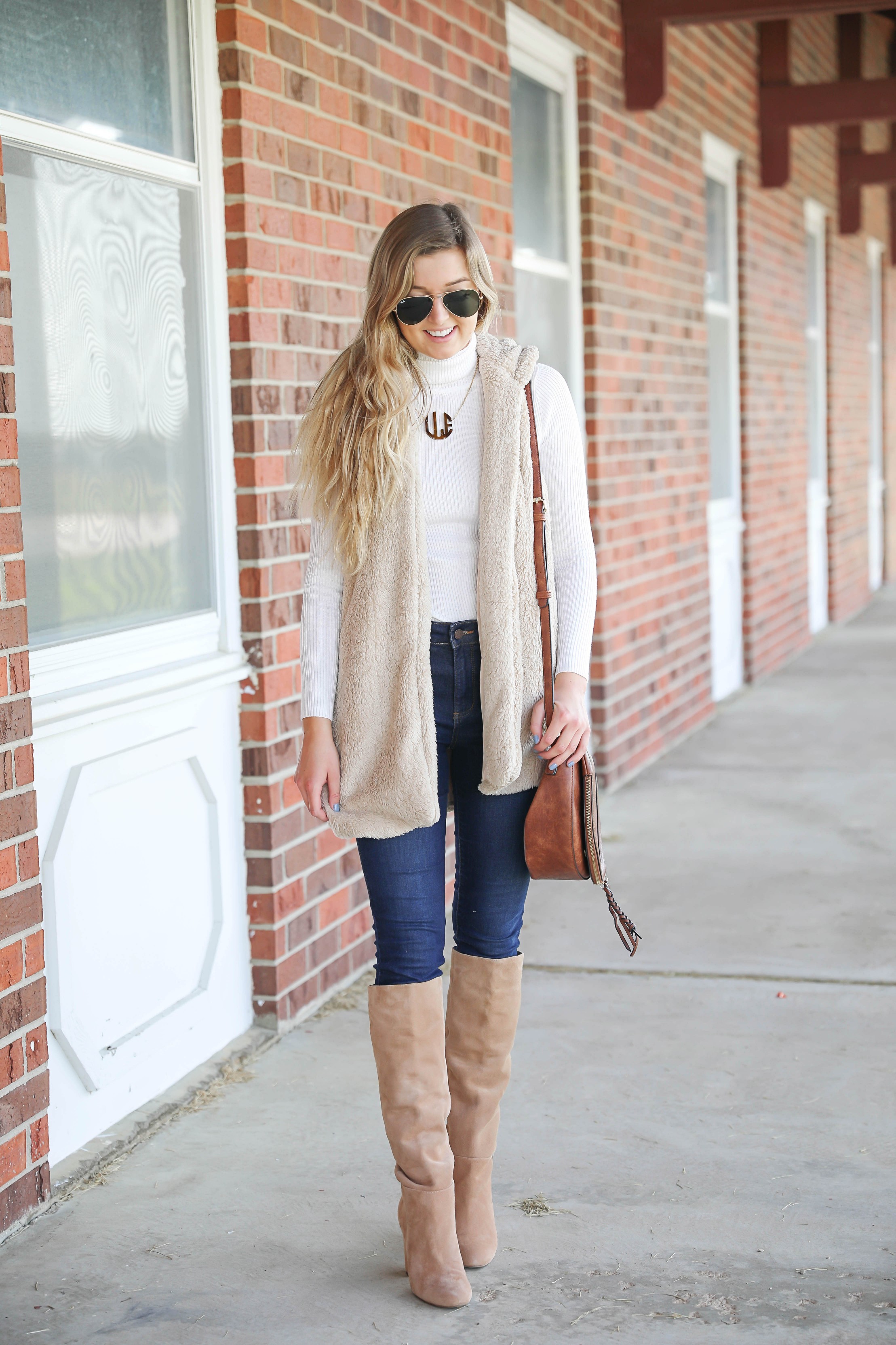 Teddy bear vest for fall! I love soft clothing and this long vest makes for the perfect fall outfit! I paired with a cute white turtleneck and monogram necklace! Plus my favorite shoes for fall are these tan sam edelman boots! Details on fashion blog daily dose of charm by lauren lindmark