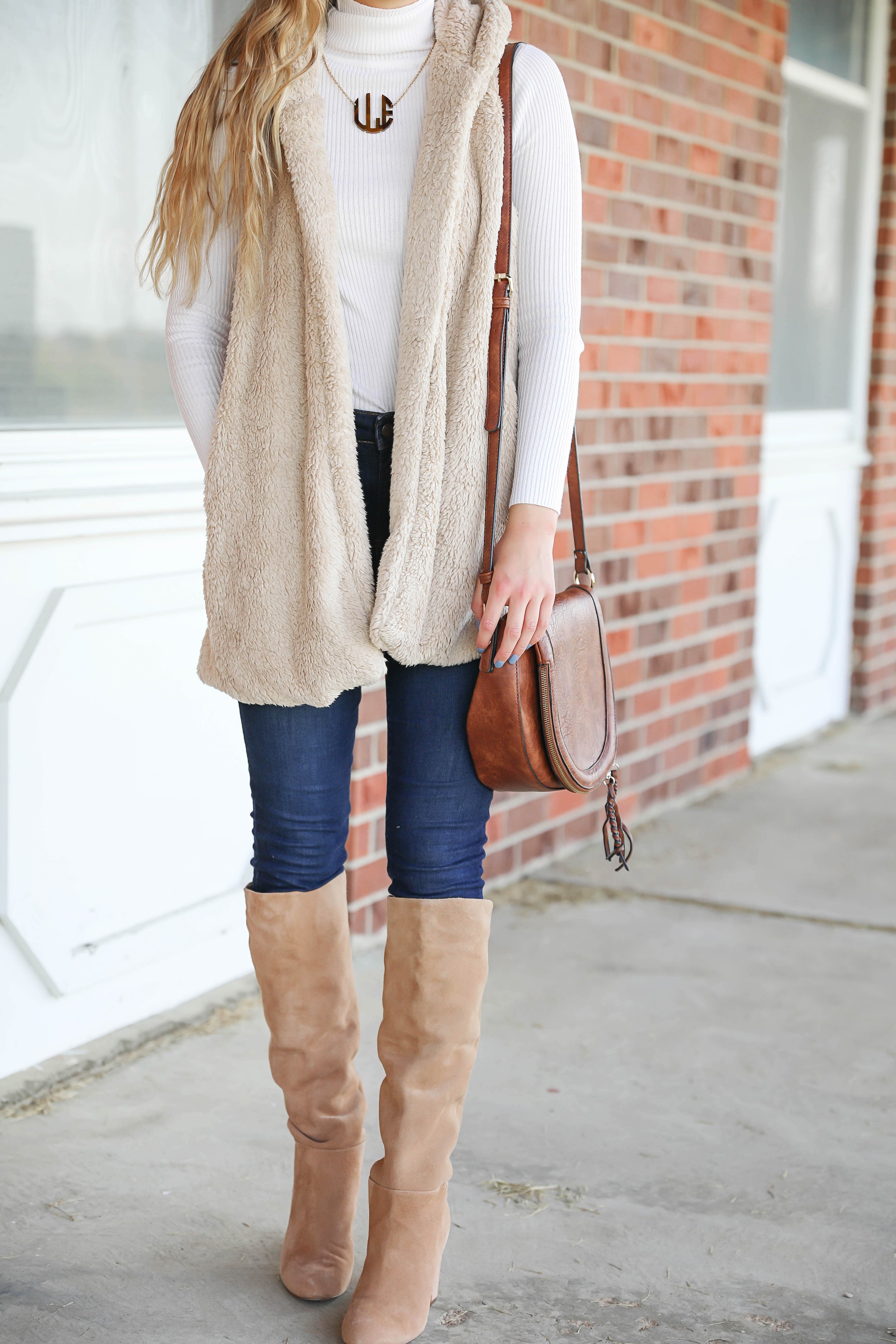 Teddy bear vest for fall! I love soft clothing and this long vest makes for the perfect fall outfit! I paired with a cute white turtleneck and monogram necklace! Plus my favorite shoes for fall are these tan sam edelman boots! Details on fashion blog daily dose of charm by lauren lindmark