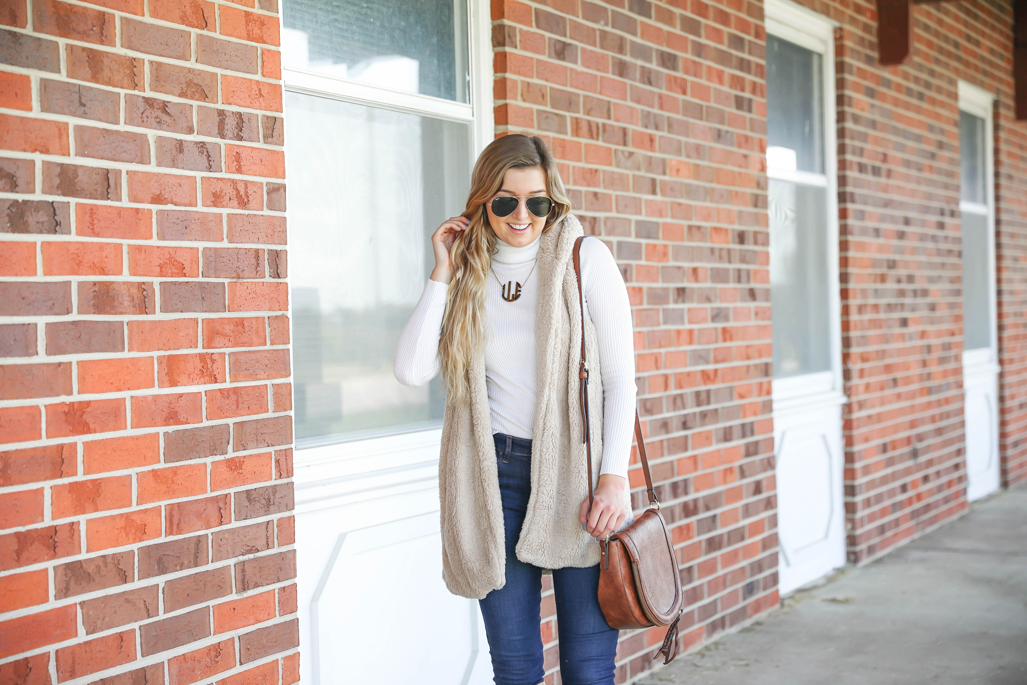 Teddy bear vest for fall! I love soft clothing and this long vest makes for the perfect fall outfit! I paired with a cute white turtleneck and monogram necklace! Plus my favorite shoes for fall are these tan sam edelman boots! Details on fashion blog daily dose of charm by lauren lindmark