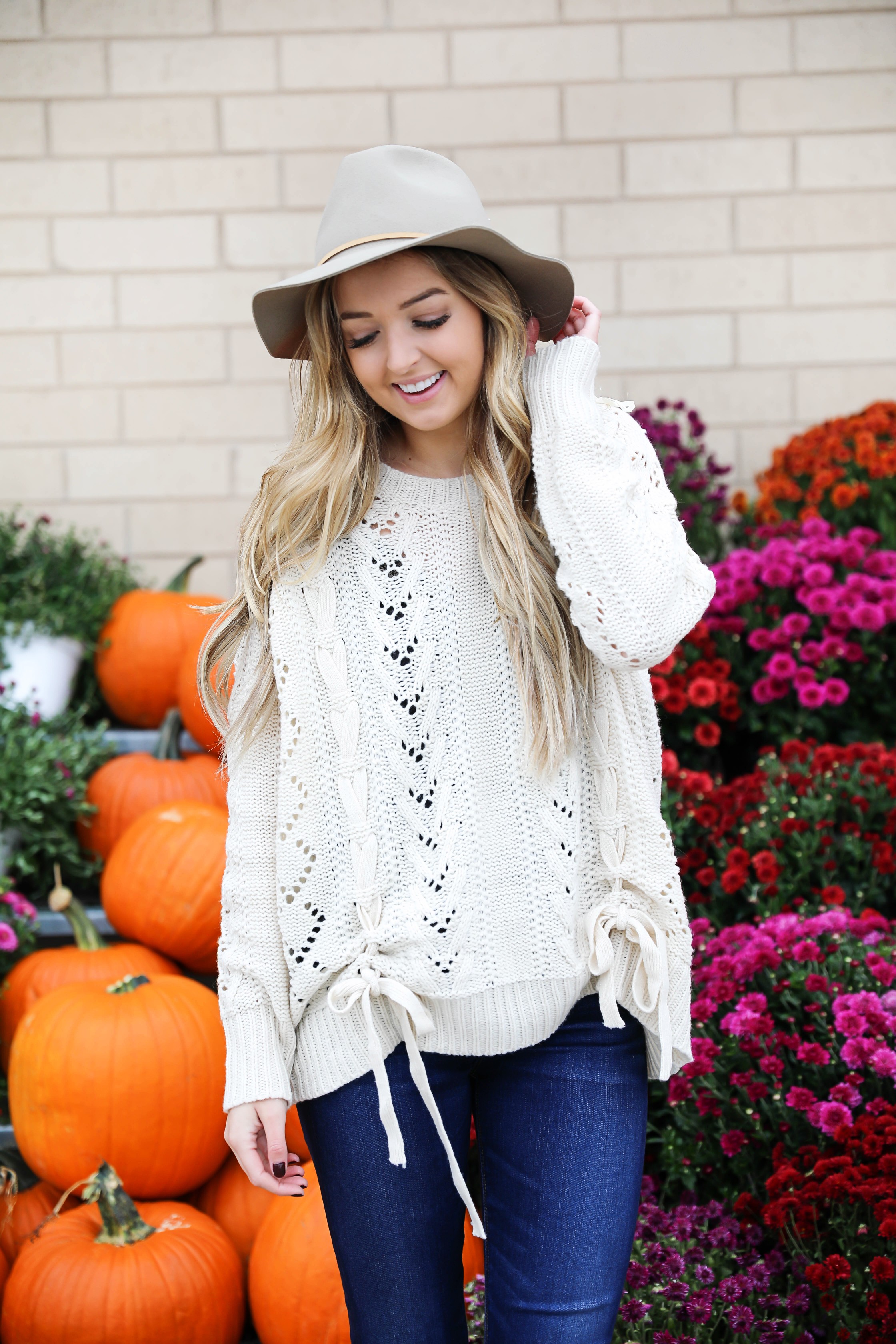 Braided sweater from Core Boutique with dark denim and my favorite felt hat! Fall fashion ideas on fashion blog daily dose of charm by lauren lindmark