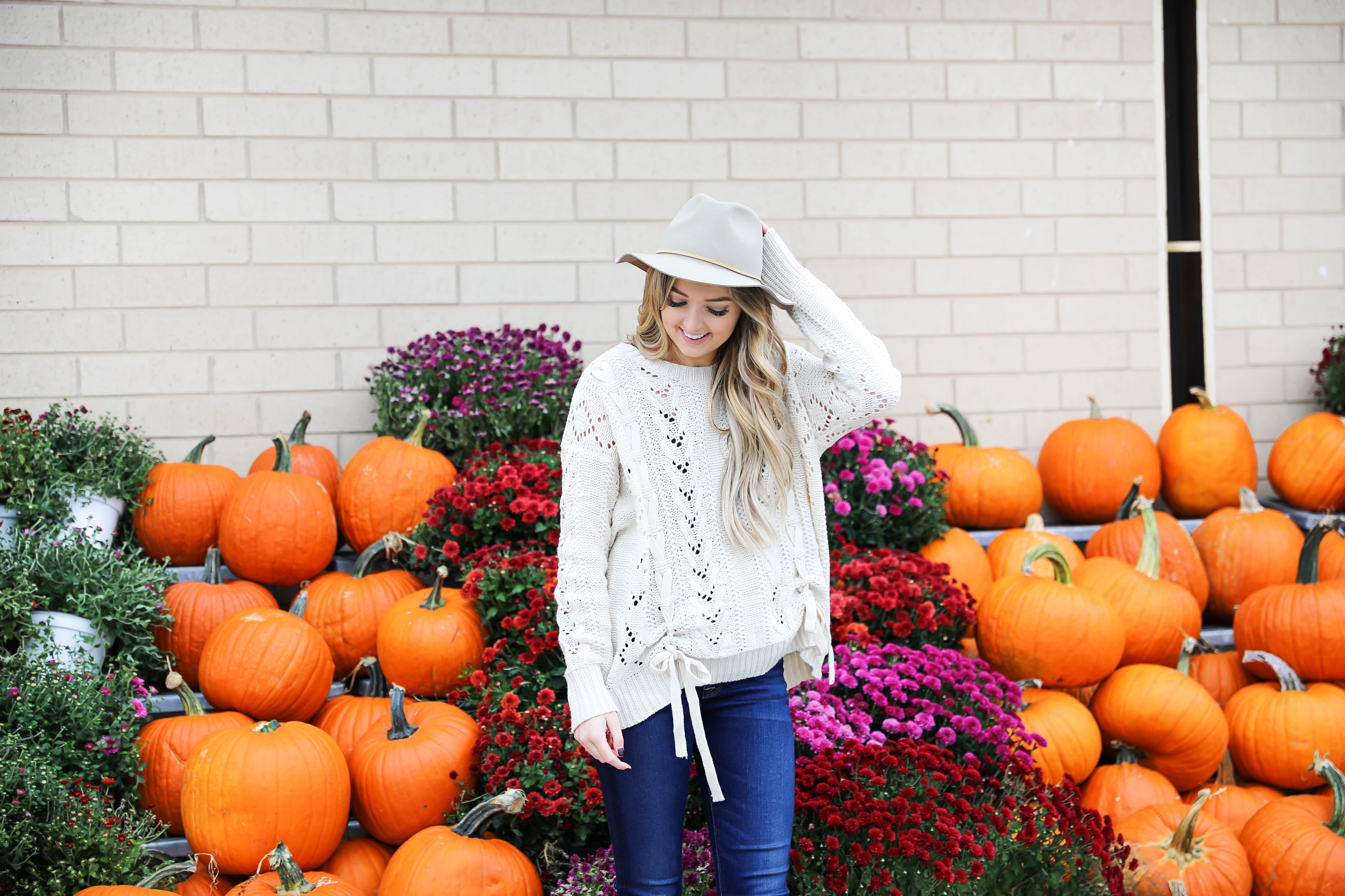 Braided sweater from Core Boutique with dark denim and my favorite felt hat! Fall fashion ideas on fashion blog daily dose of charm by lauren lindmark