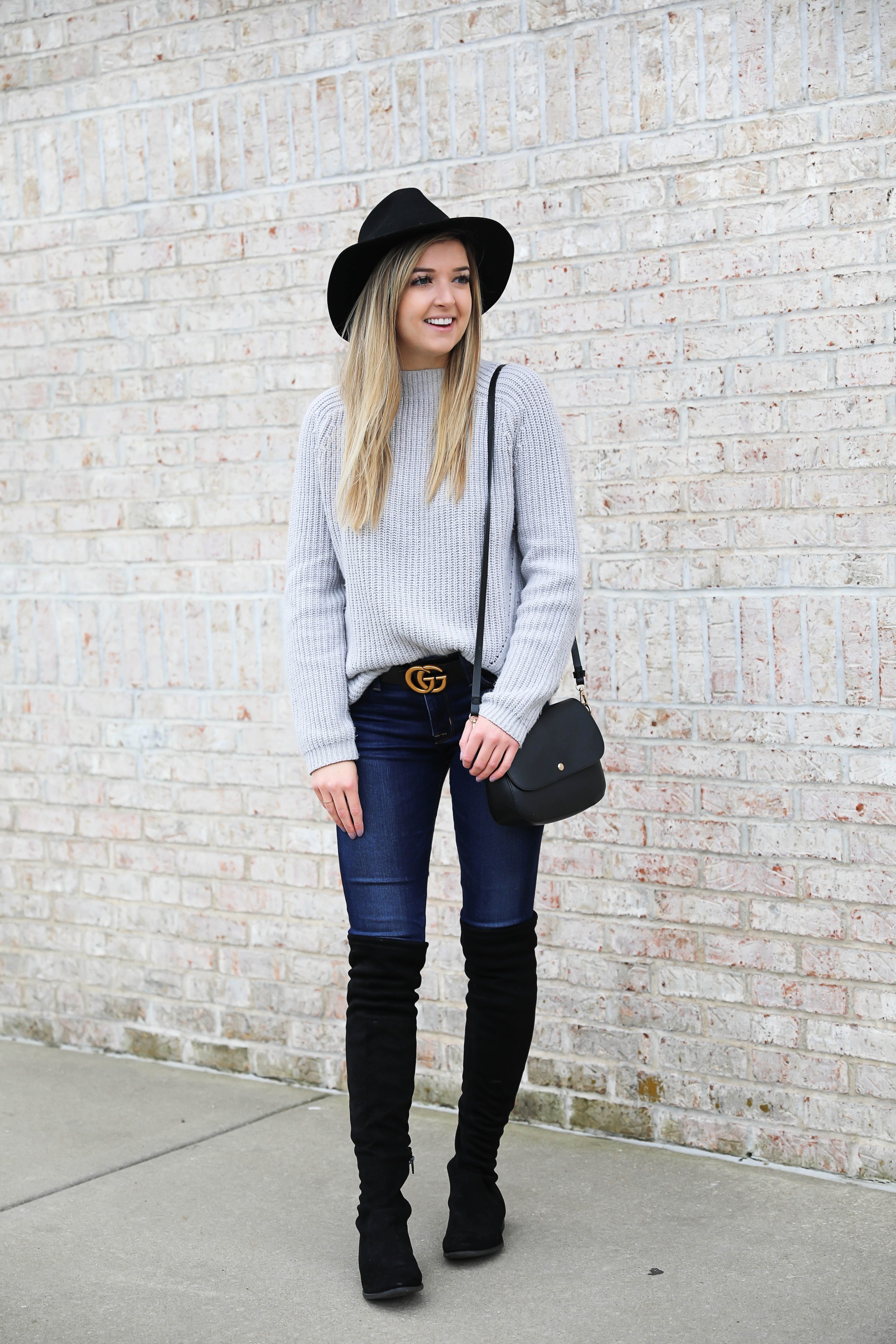 Gray sweater paired with dark denim and this super cute $30 gucci belt! I love these black over the knee boots and my felt hat for fall! Get outfit details on daily dose of charm by lauren lindmark