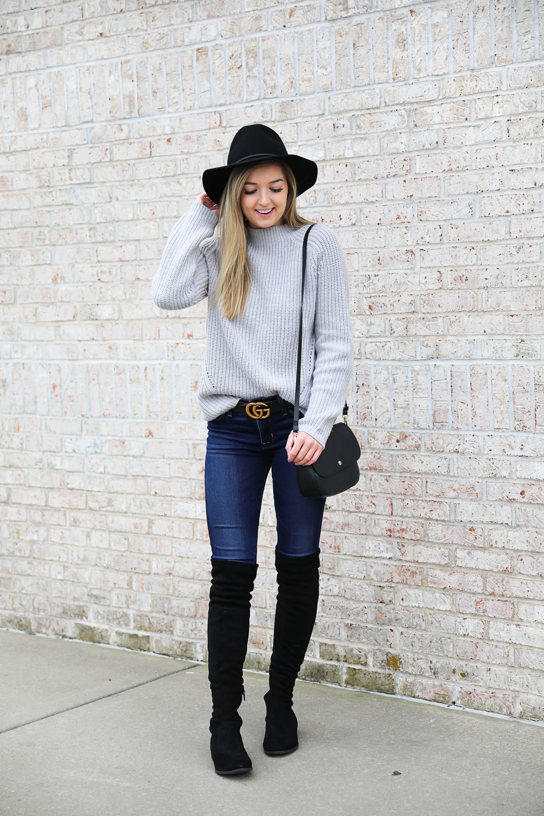 Gray sweater paired with dark denim and this super cute $30 gucci belt! I love these black over the knee boots and my felt hat for fall! Get outfit details on daily dose of charm by lauren lindmark