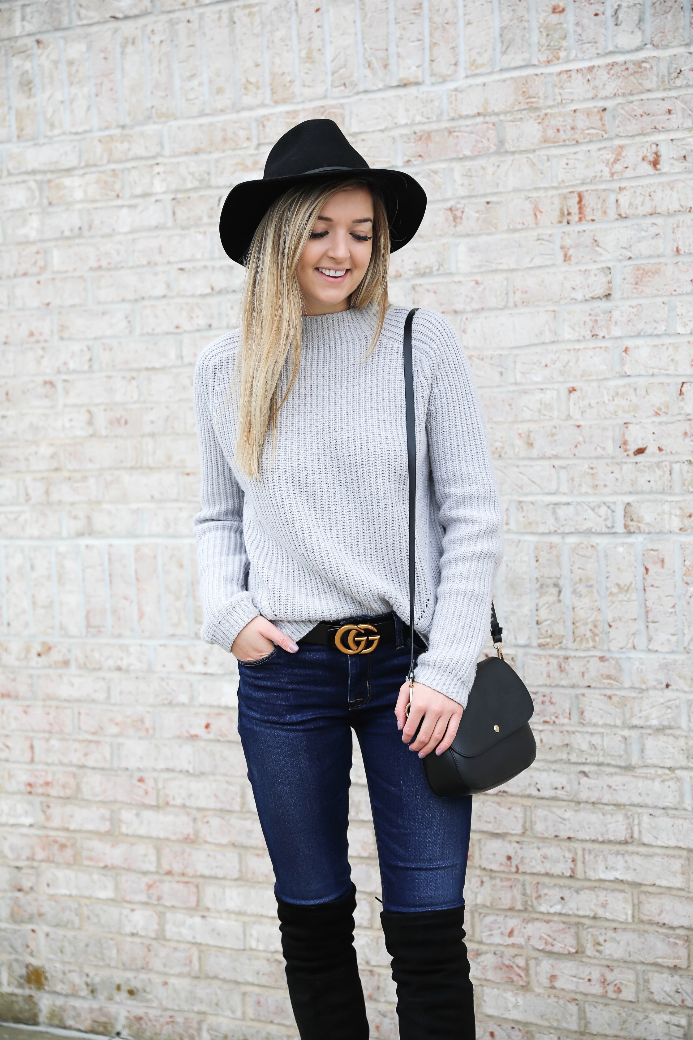 Gray sweater paired with dark denim and this super cute $30 gucci belt! I love these black over the knee boots and my felt hat for fall! Get outfit details on daily dose of charm by lauren lindmark