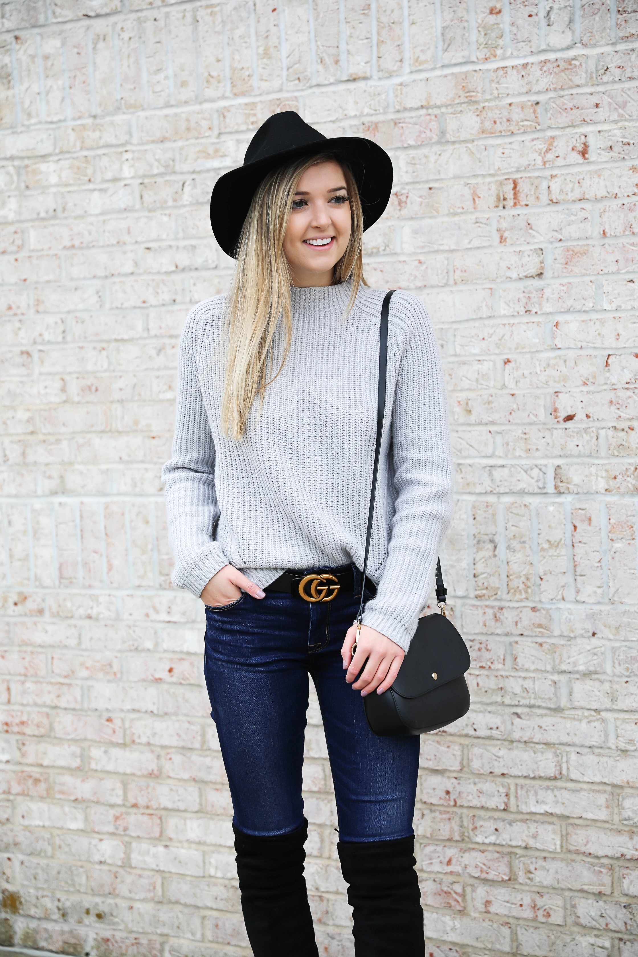 Gray sweater paired with dark denim and this super cute $30 gucci belt! I love these black over the knee boots and my felt hat for fall! Get outfit details on daily dose of charm by lauren lindmark