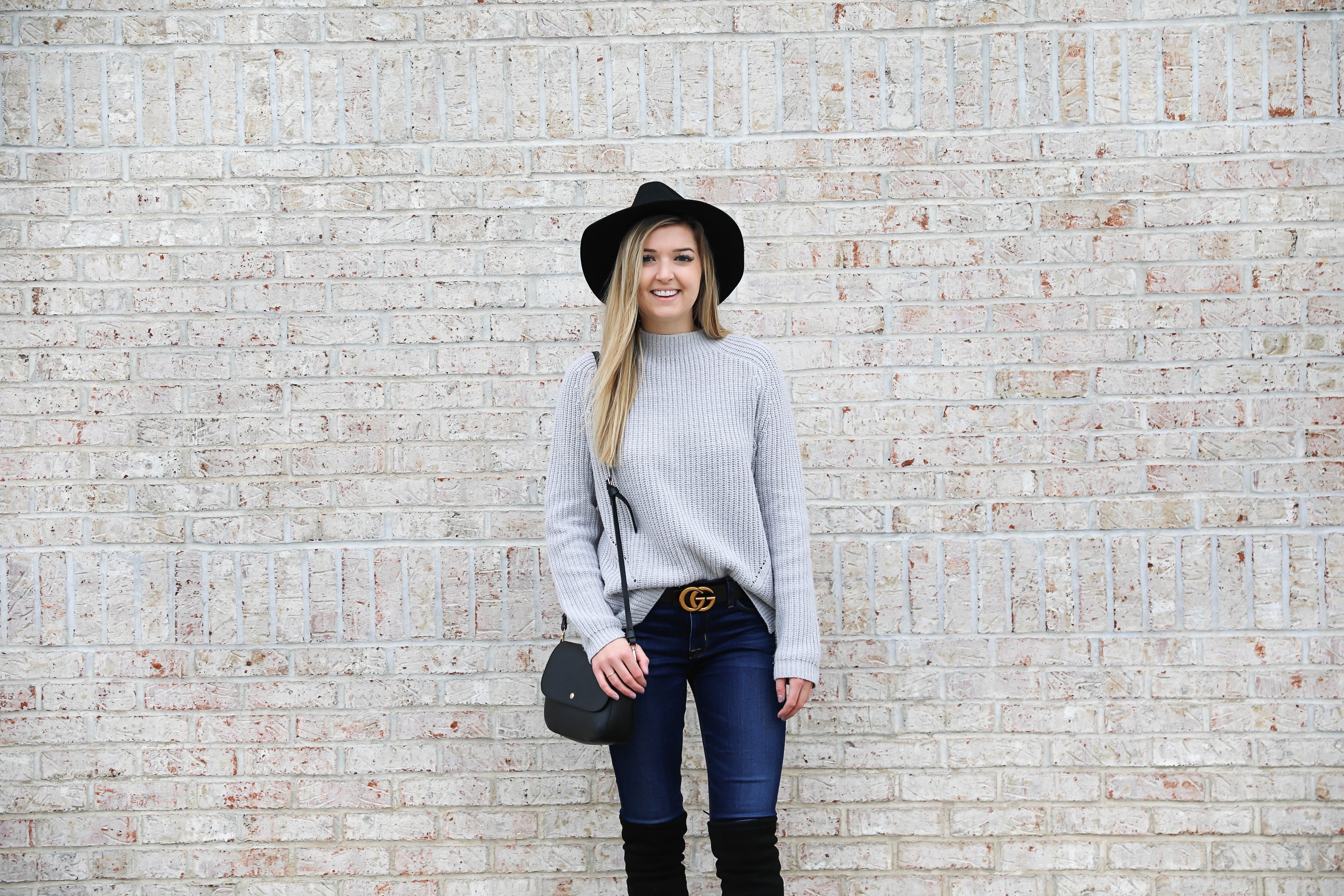 Gray sweater paired with dark denim and this super cute $30 gucci belt! I love these black over the knee boots and my felt hat for fall! Get outfit details on daily dose of charm by lauren lindmark