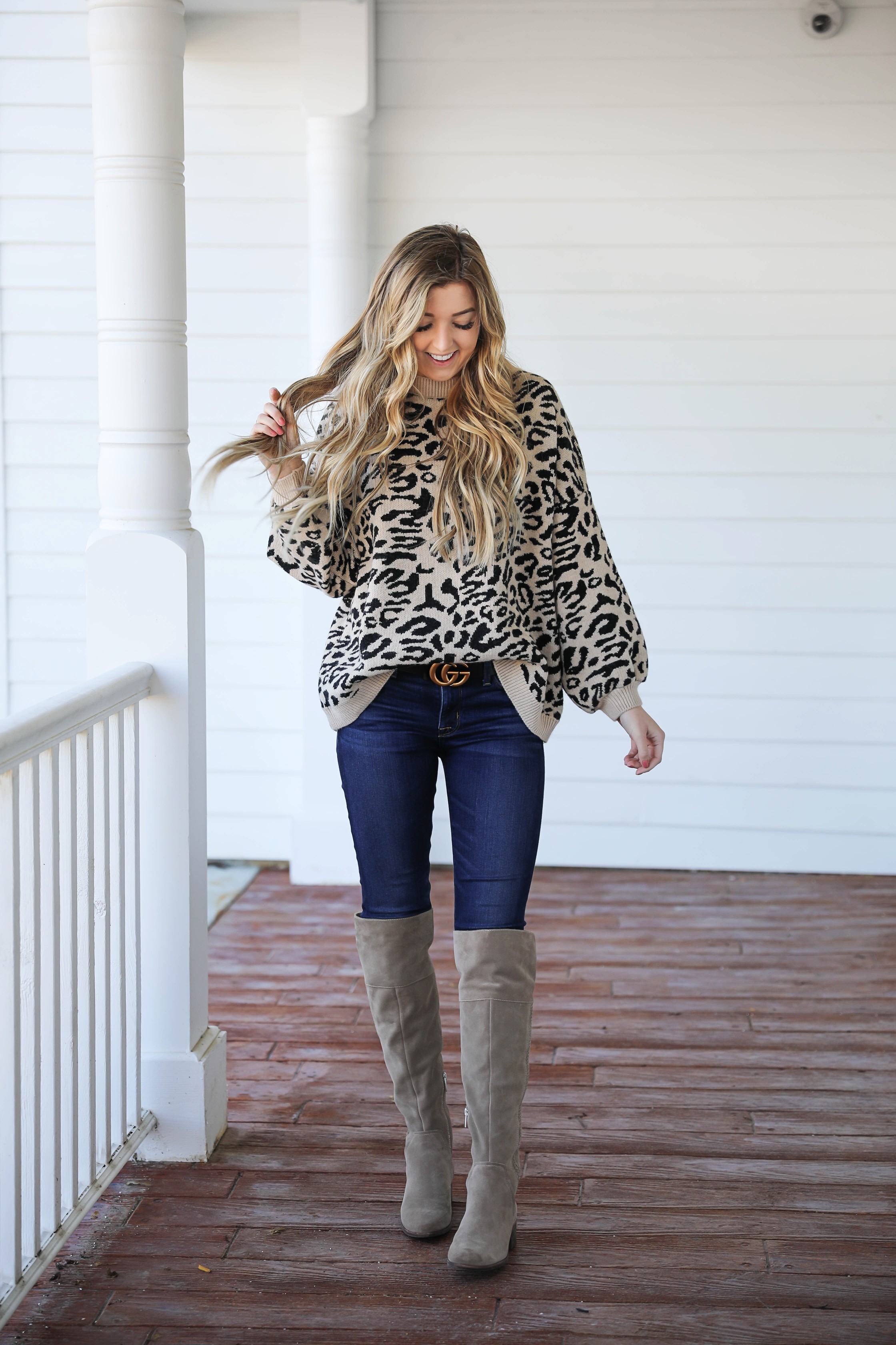 Leopard sweater for fall! Paired with my favorite $30 Gucci belt and Vince Camuto over the knee boots! Such a cute fall outfit idea! Details on fashion blog daily dose of charm by Lauren Lindmark
