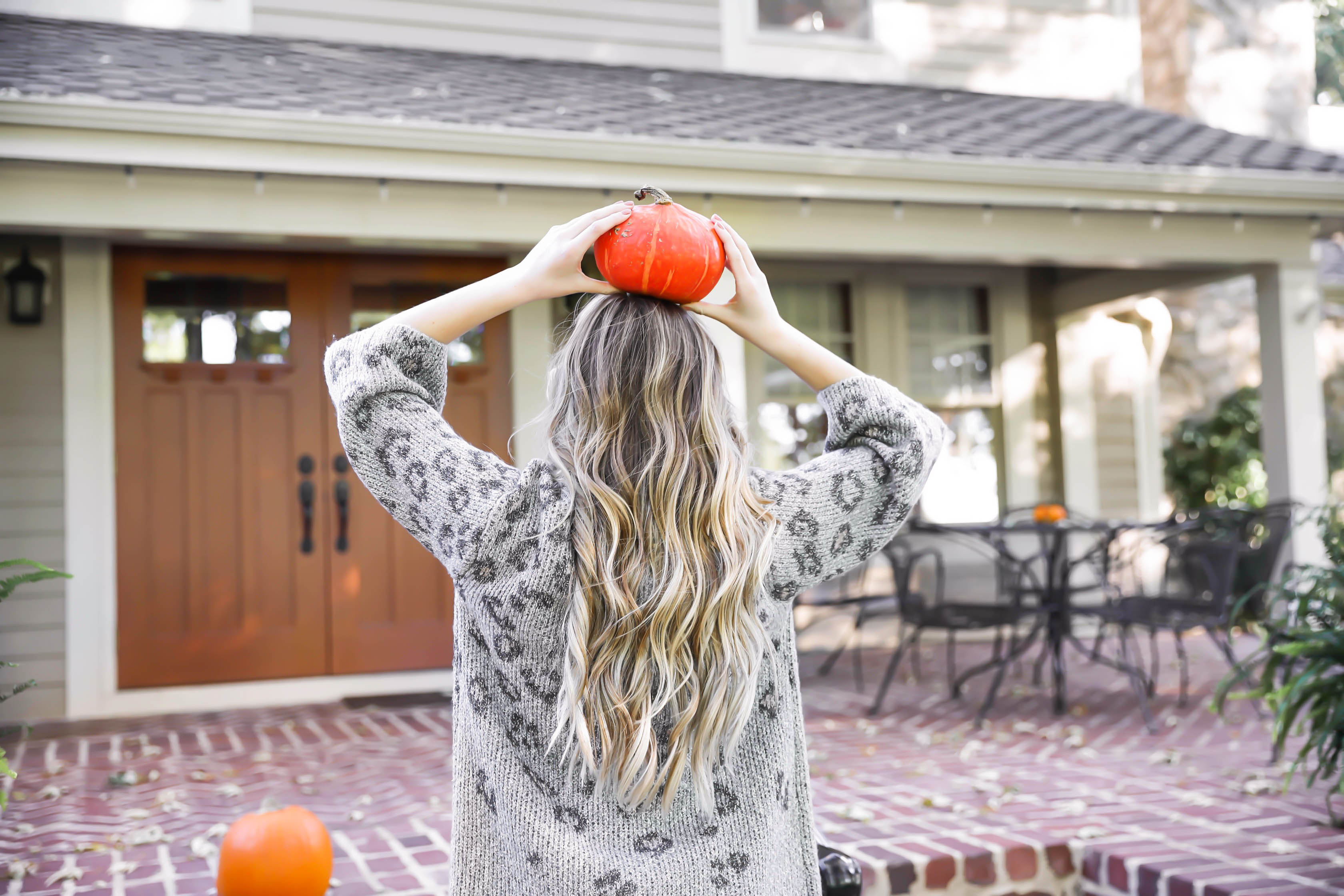 Natural beaded row extensions! The best stylist for NBR extensions in Kansas City is Traci Morby! Fall outfit idea! Sitting on a porch of pumpkins wearing my favorite leopard cardigan! Details on fashion blog daily dose of charm by lauren lindmark