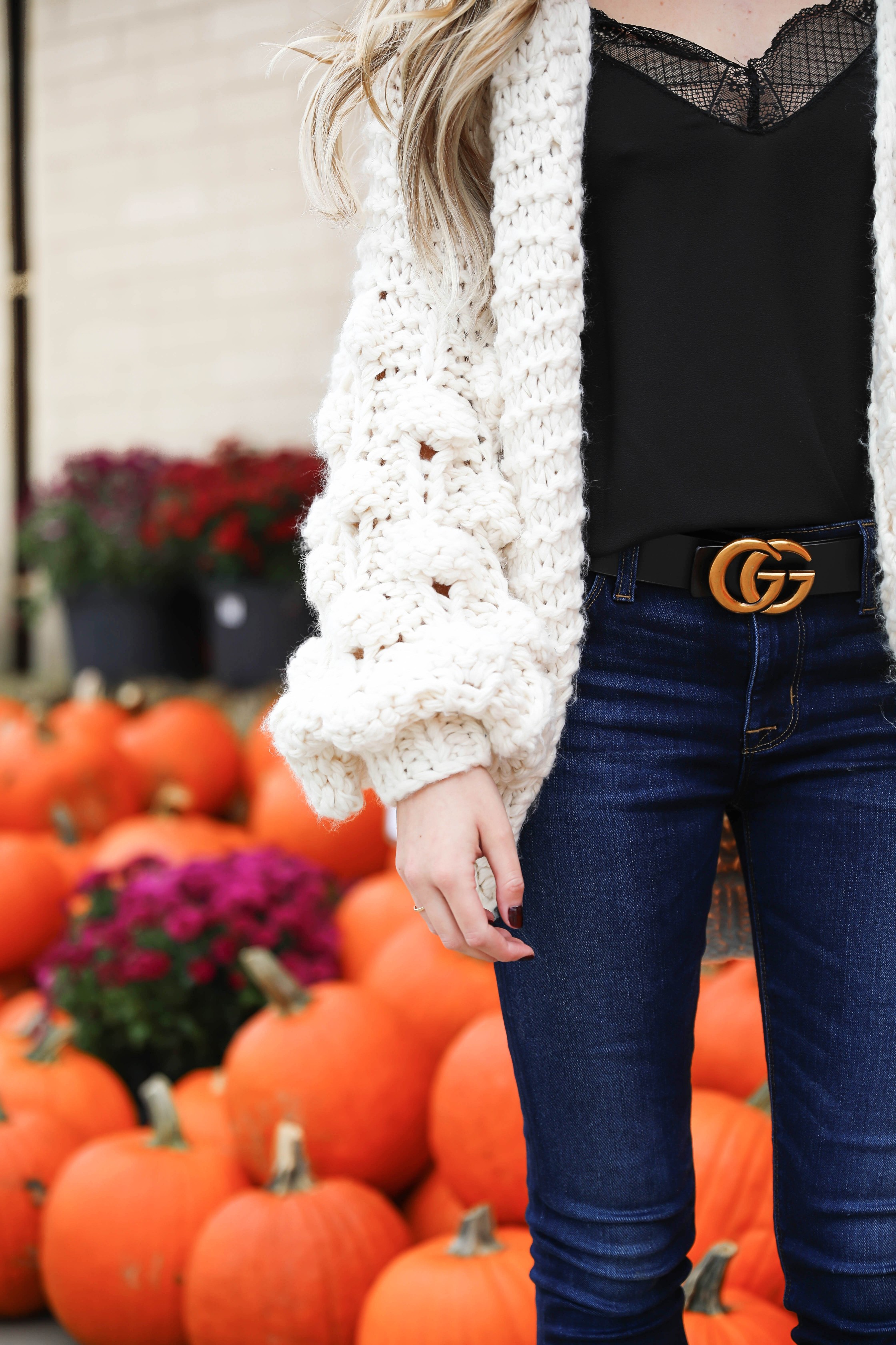 Puffy sleeve knit cardigan! I love finding unique ivory sweaters for fall and winter! I paired it with my favorite black lacey cami and gucci belt! Nothing like dark jeans and leopard shoes for fall! Details on fashion blog daily dose of charm by lauren lindmark