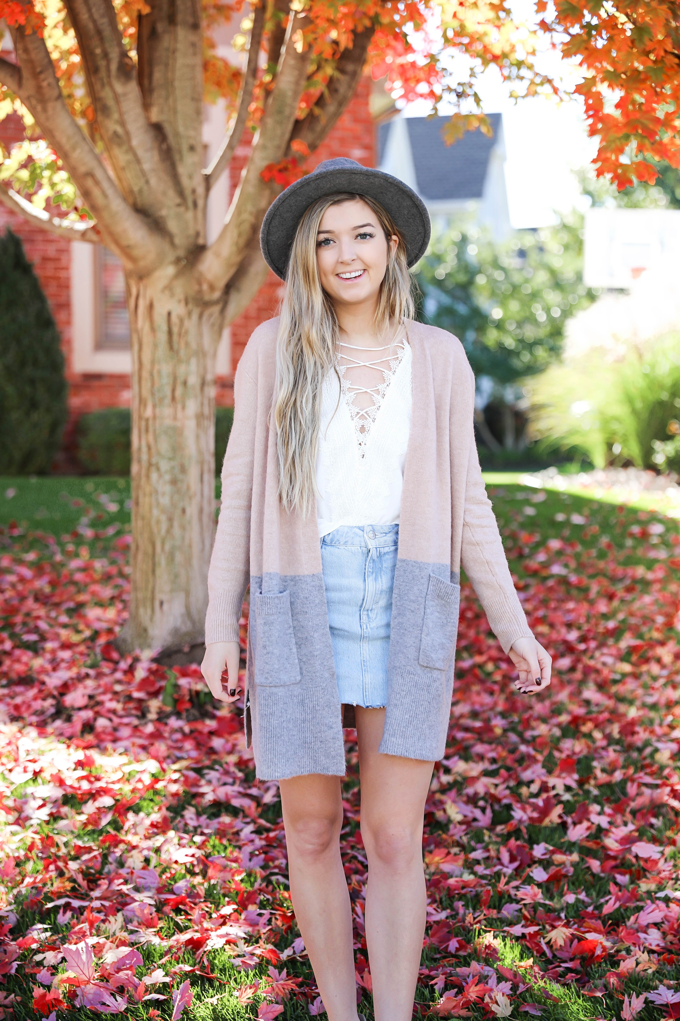 Two ways to style jean skirts in the fall! Jean skirt paired with a cute cardigan and jean skirt paired with a cropped sweater! Details on fashion blog daily dose of charm by lauren lindmark