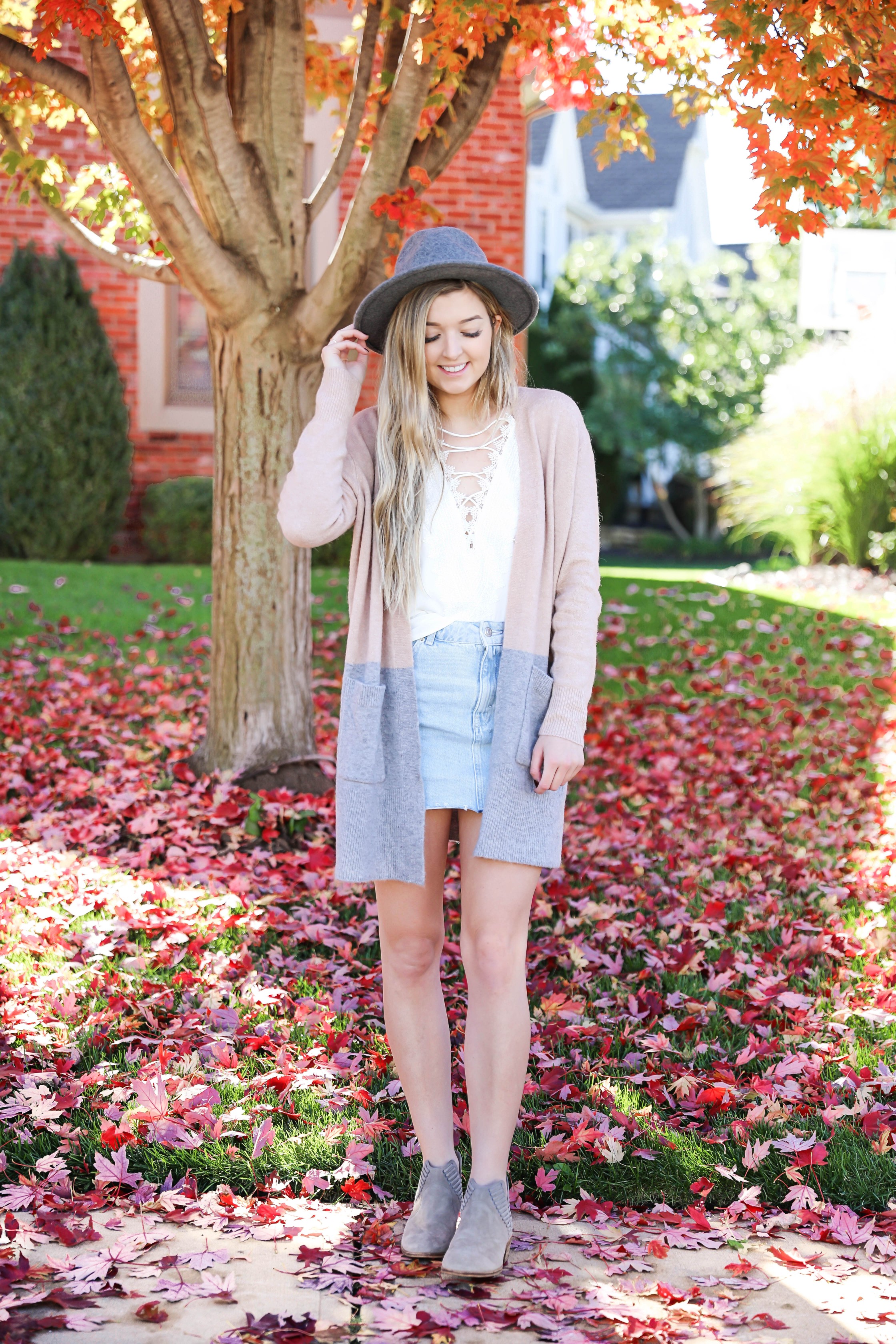 Two ways to style jean skirts in the fall! Jean skirt paired with a cute cardigan and jean skirt paired with a cropped sweater! Details on fashion blog daily dose of charm by lauren lindmark