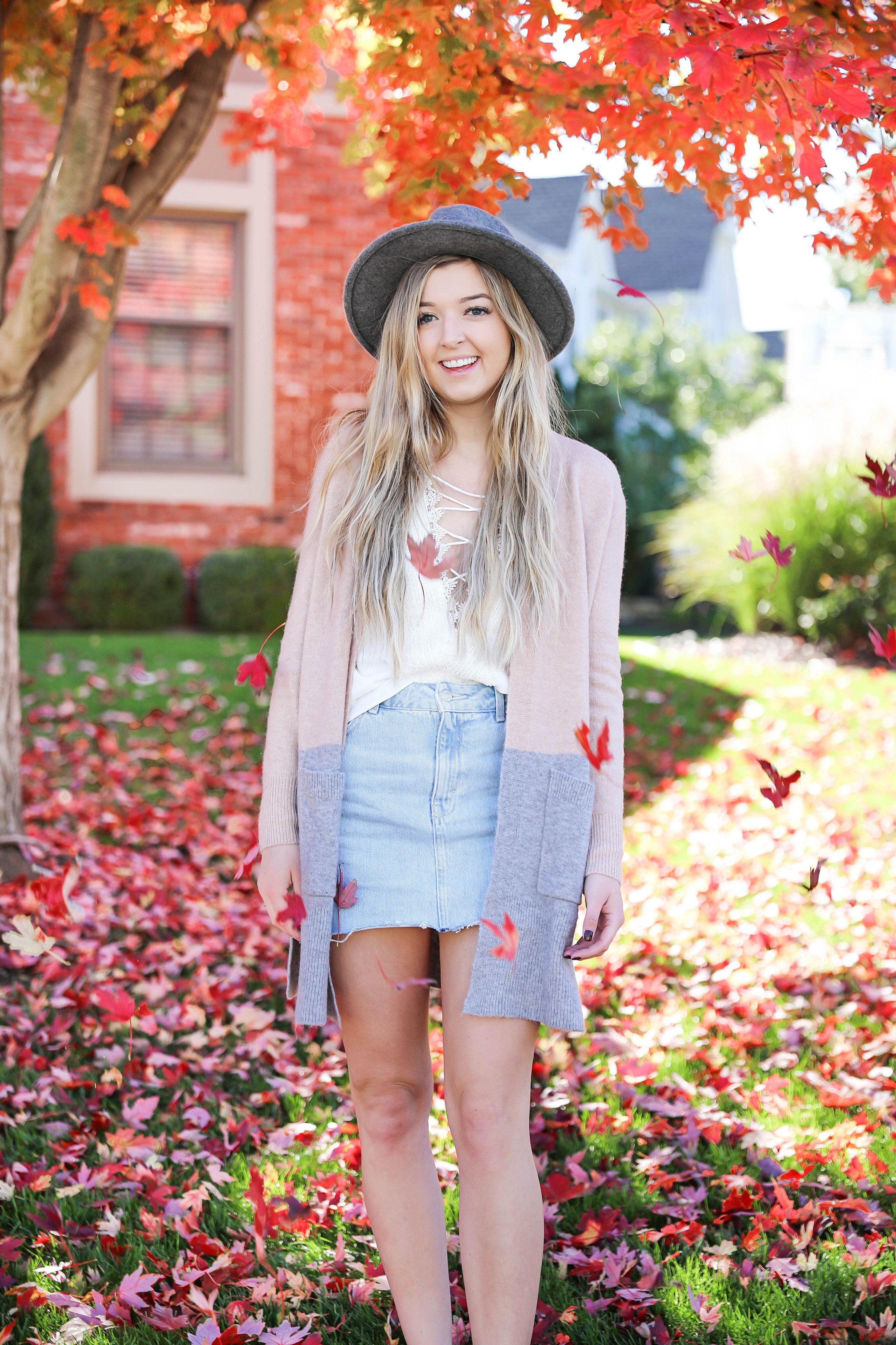 Two ways to style jean skirts in the fall! Jean skirt paired with a cute cardigan and jean skirt paired with a cropped sweater! Details on fashion blog daily dose of charm by lauren lindmark