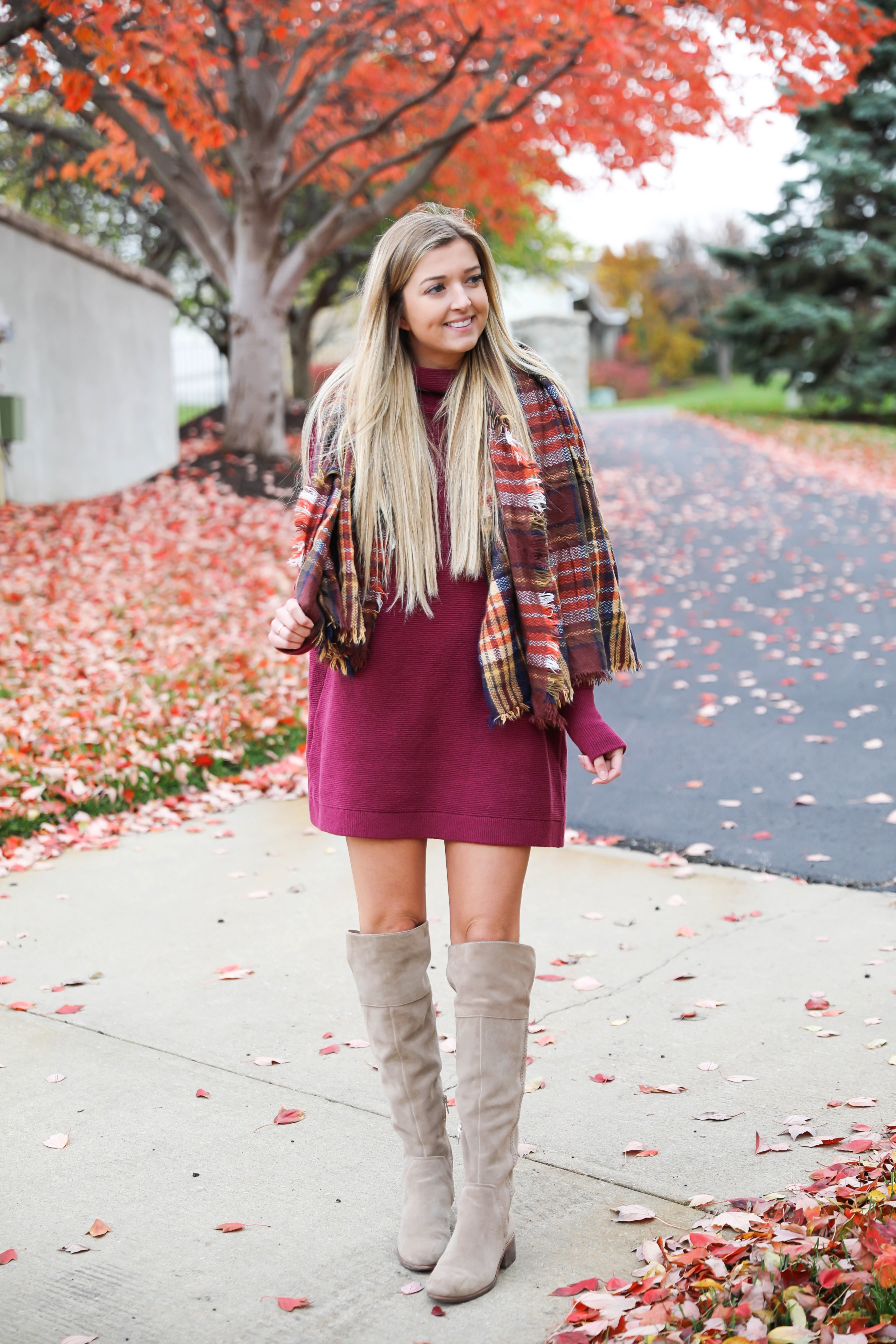 Burgundy sweater dress paired with a cute plaid scarf! Such a cute thanksgiving outfit! This cute fall dress is by free people and this plaid scarf look so cute with it! I paired it with my suede vince camuto over the knee boots! Details on fashion blog daily dose of charm by lauren lindmark
