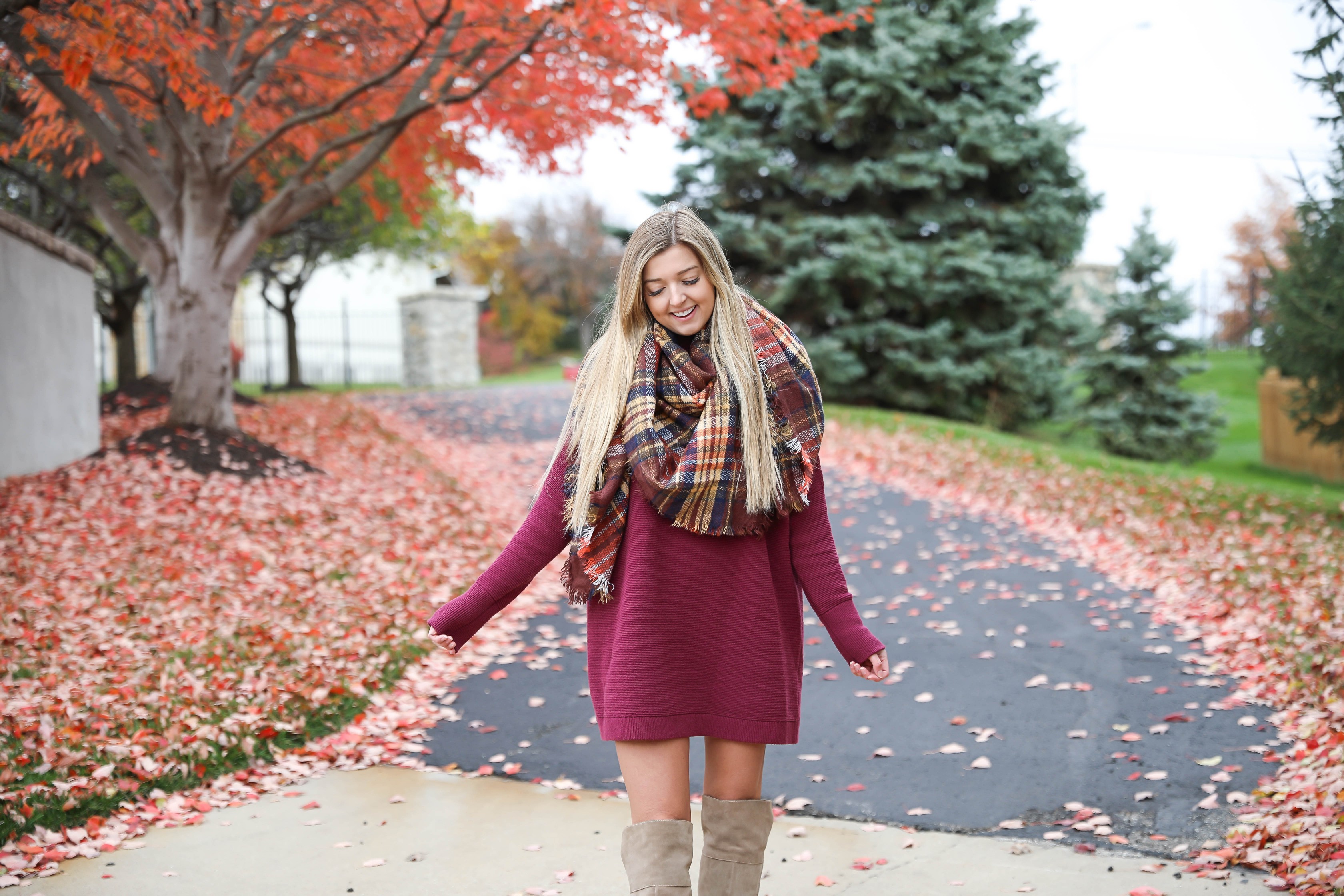 Burgundy sweater dress paired with a cute plaid scarf! Such a cute thanksgiving outfit! This cute fall dress is by free people and this plaid scarf look so cute with it! I paired it with my suede vince camuto over the knee boots! Details on fashion blog daily dose of charm by lauren lindmark