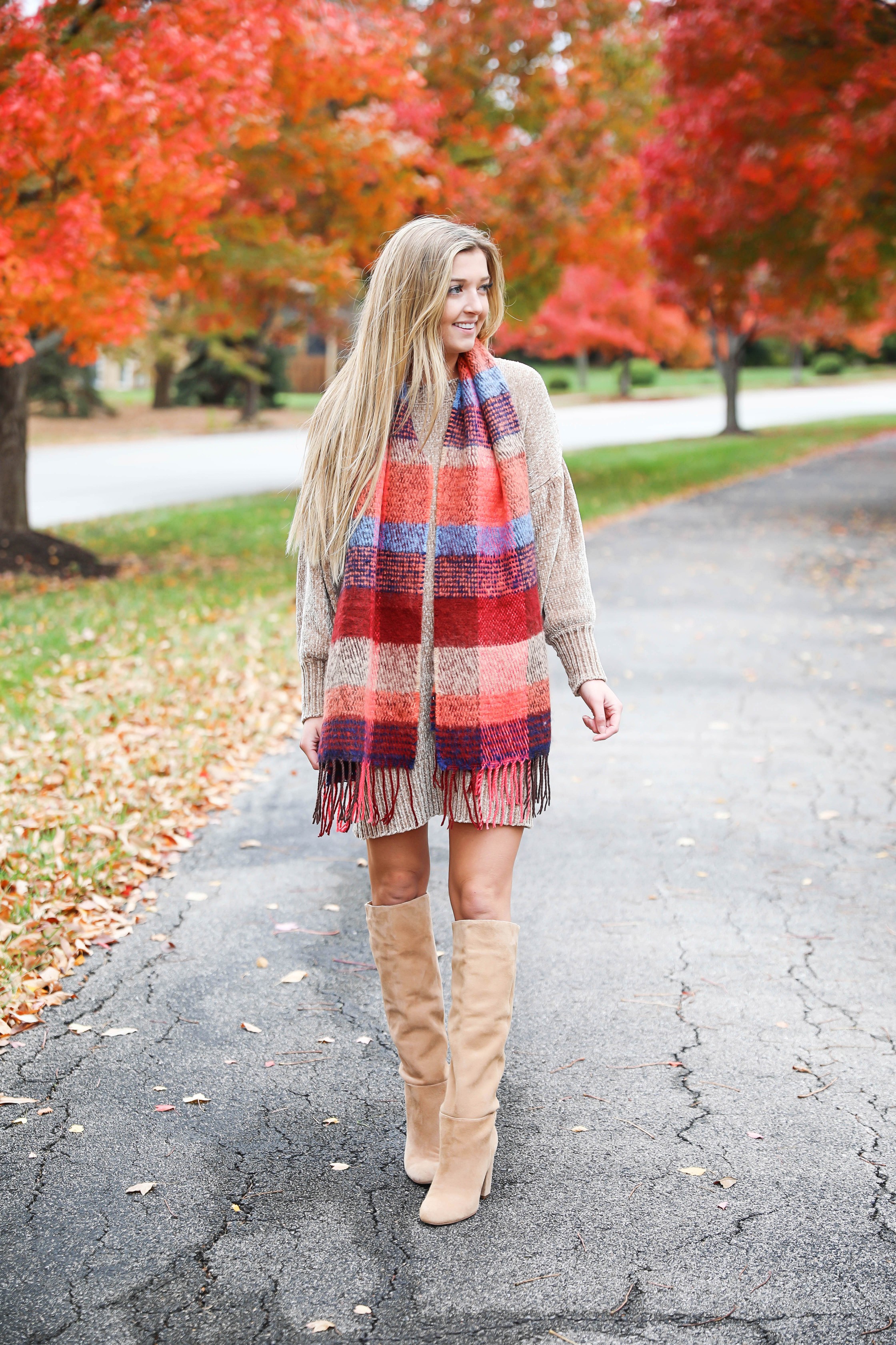 Chenille sweater dress form Red Dress Boutique! I love sweater dresses and chenille is my favorite trend for fall 2018! I paired it with this cute plaid scarf and my favorite tan boots! Nothing like a cute fall outfit in front of beautiful red autumn leaves on the trees! Details on fashion blog daily dose of charm by lauren lindmark