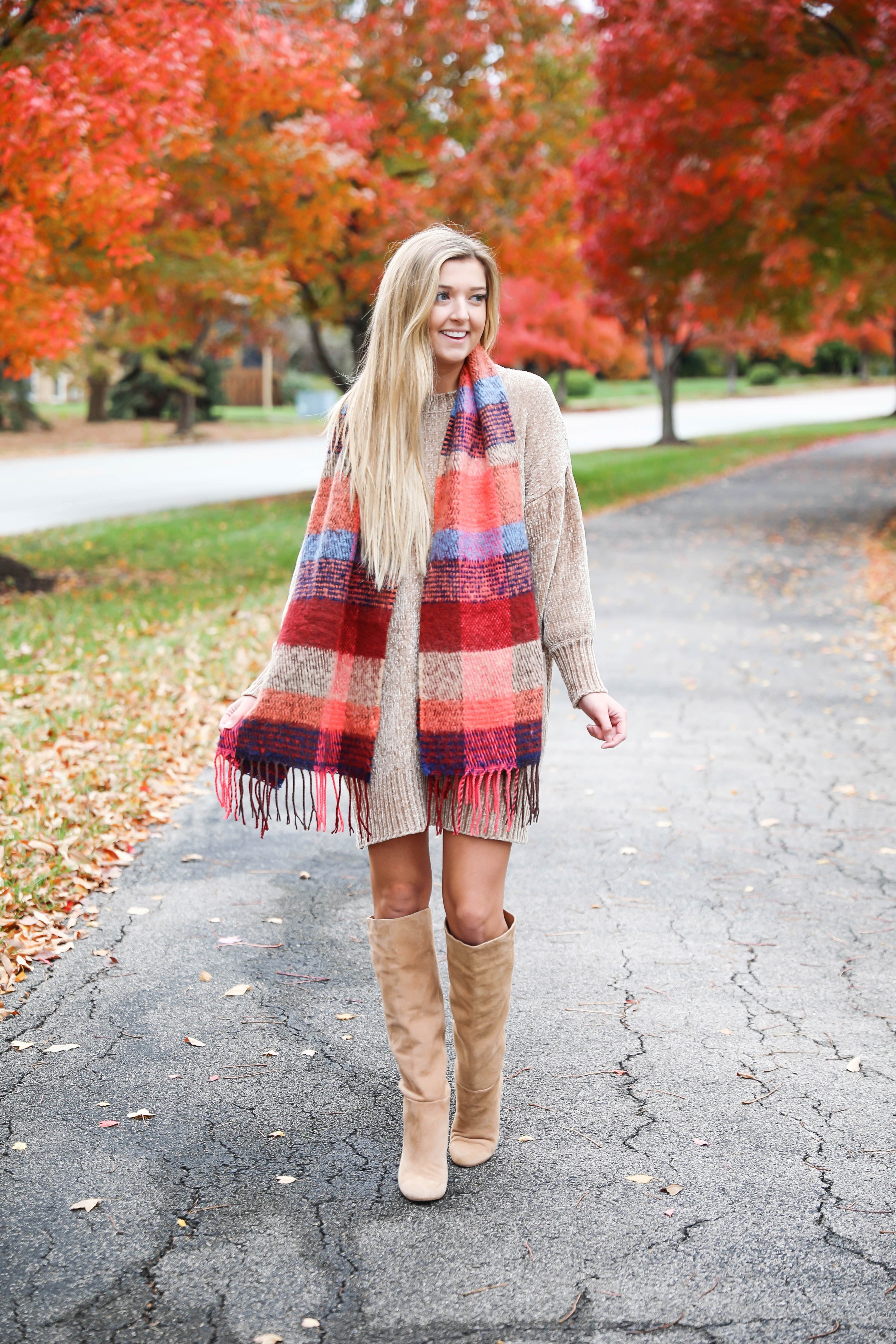 Chenille sweater dress form Red Dress Boutique! I love sweater dresses and chenille is my favorite trend for fall 2018! I paired it with this cute plaid scarf and my favorite tan boots! Nothing like a cute fall outfit in front of beautiful red autumn leaves on the trees! Details on fashion blog daily dose of charm by lauren lindmark