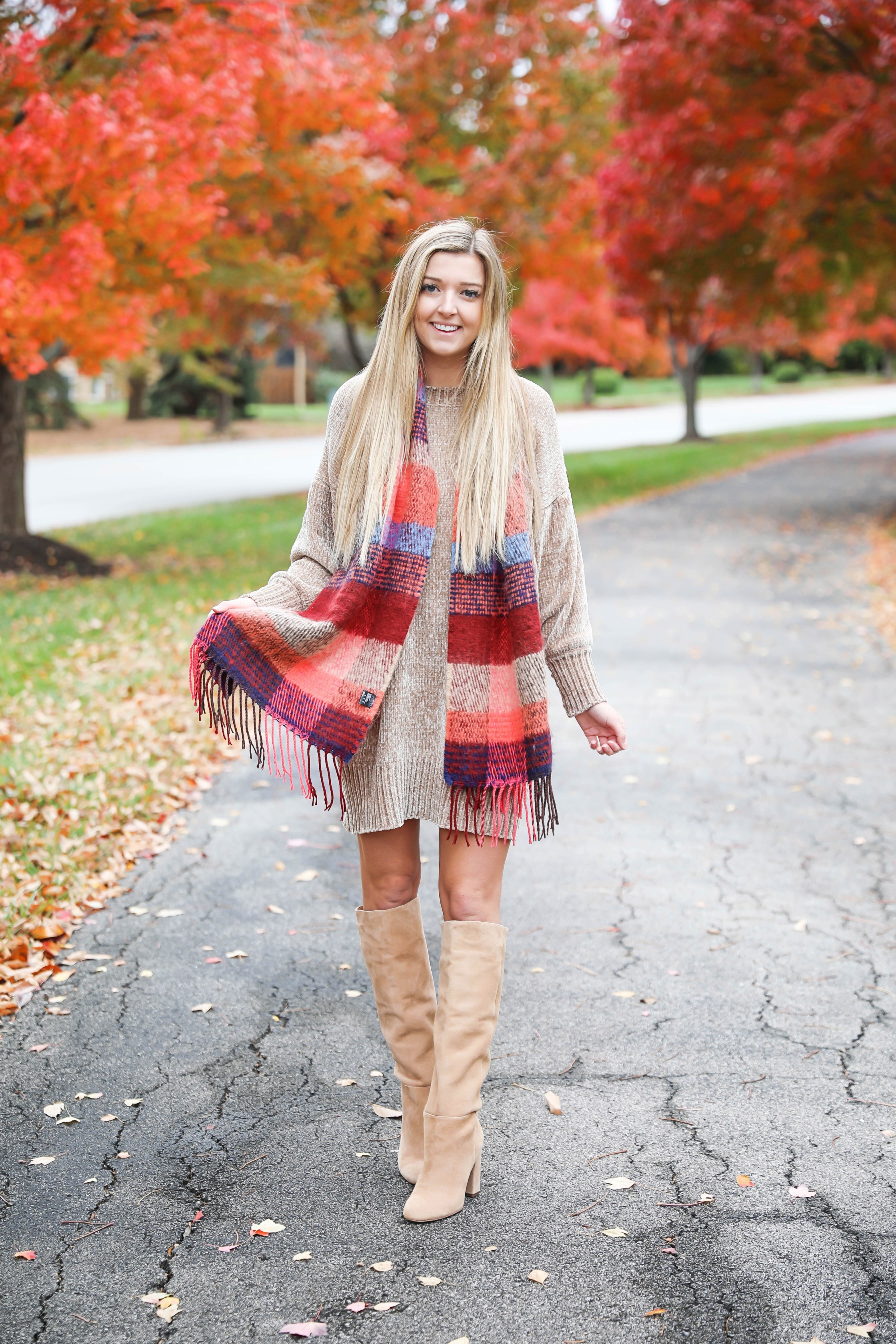 Chenille sweater dress form Red Dress Boutique! I love sweater dresses and chenille is my favorite trend for fall 2018! I paired it with this cute plaid scarf and my favorite tan boots! Nothing like a cute fall outfit in front of beautiful red autumn leaves on the trees! Details on fashion blog daily dose of charm by lauren lindmark